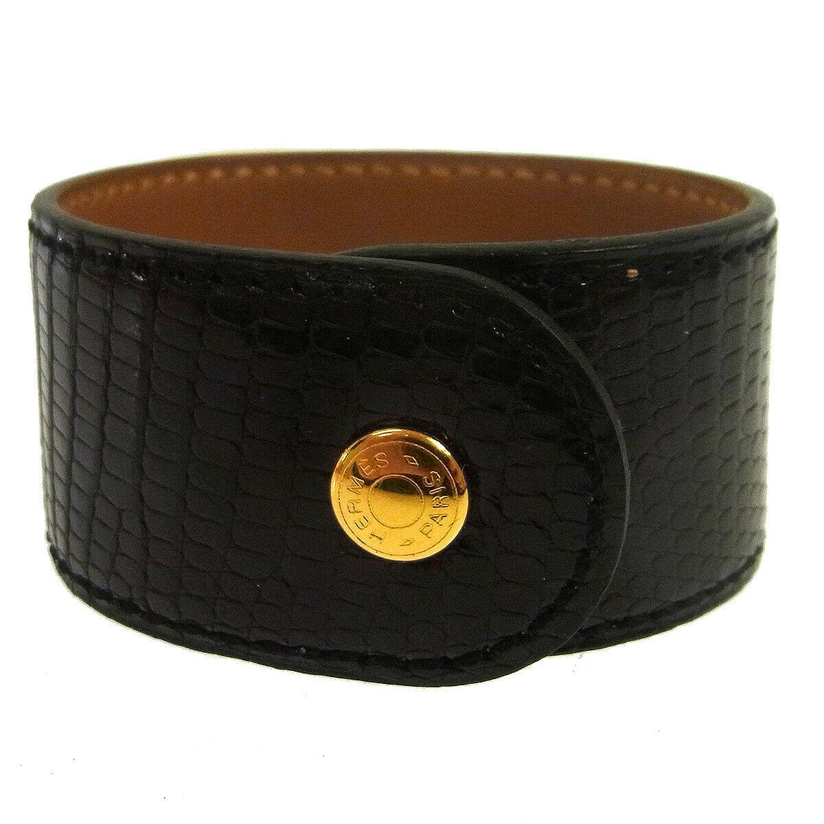 Hermes Black Leather Lizard Exotic Gold Stud Men's Women's Evening Cuff Bracelet in Box

Leather
Metal
Gold tone hardware
Snap closure
Made in France
Date code present
Width 1