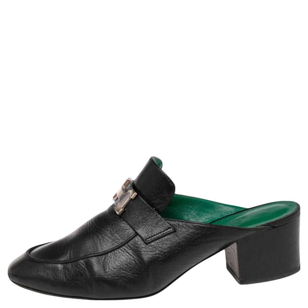 Mules are a coveted style and we can see why. They are super comfortable, classy, and can work all day without any hassle, just like these Hermes ones. They are crafted from black leather and feature round toes, signature H detailing on the vamps,