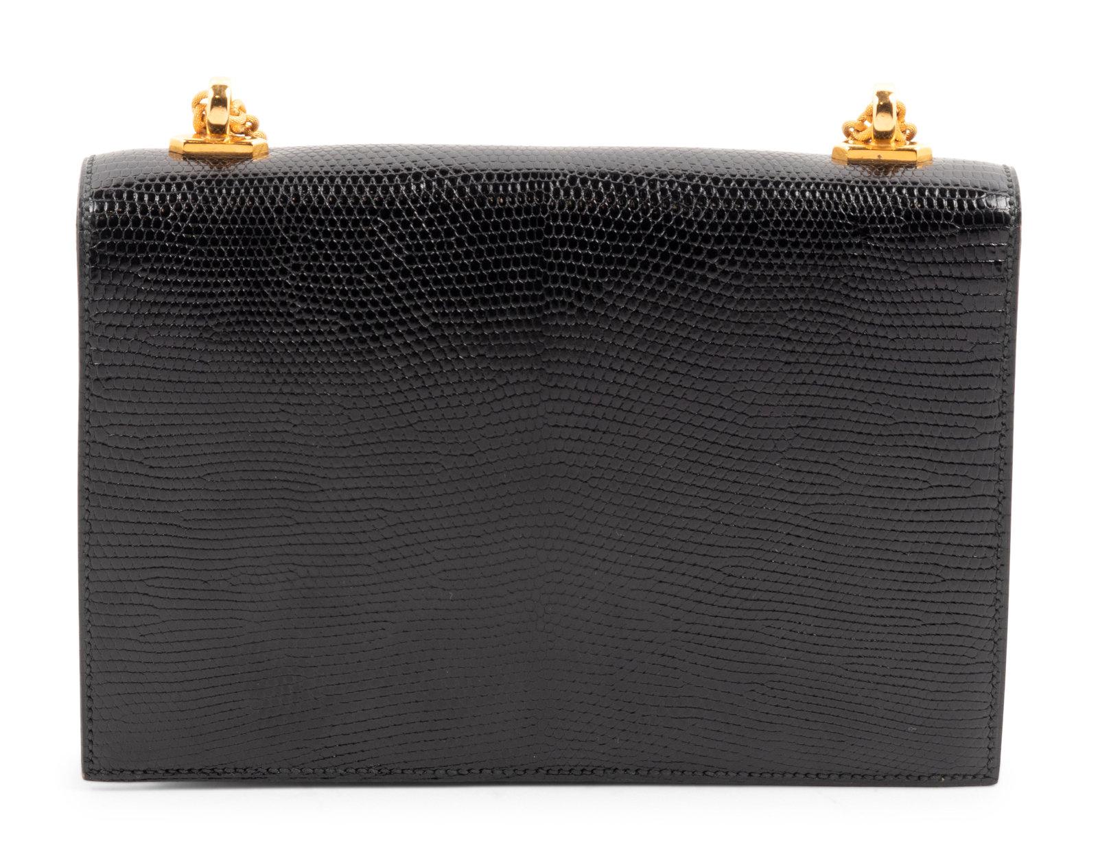 Hermès Black Lizard Alcazar Top Handle Shoulder Bag, 1980. This collectors piece is truly an exceptional representation of the Hermès craftsmanship and attention to detail. The structure of the Alcazar is bold and elegant, perfect for formal