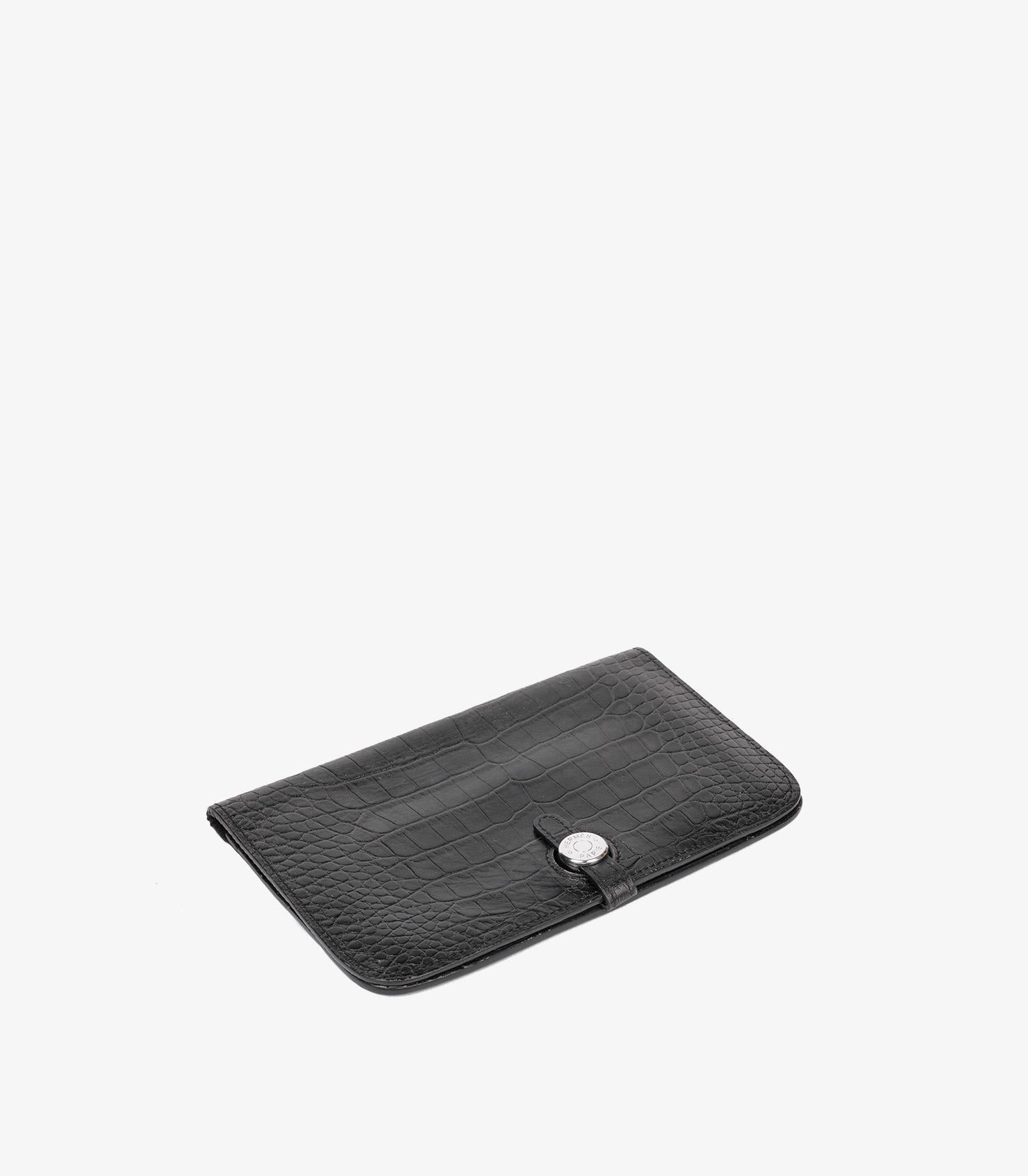 Hermès Black Matte Porosus Crocodile Dogon GM

Product Details
Xupes Ref: AA0319
Brand: Hermès
Model: Dogon Long Wallet
Type: Wallet
Serial Number: [M]
Age: 2009
Colour: Black 
Hardware: Palladium
Material(s): Matte Porosus