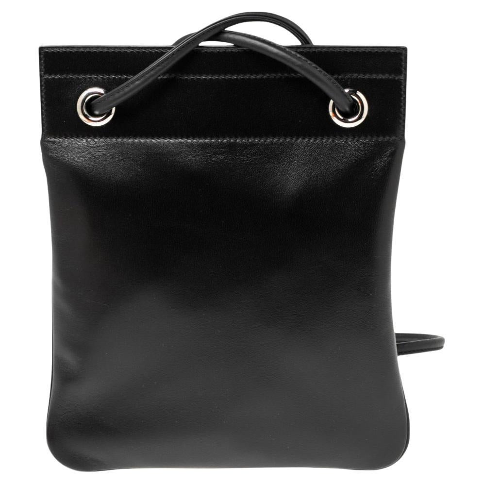 This Hermes Aline bag is made from black leather. It features a leather shoulder strap and silver-tone hardware. The bag opens to a spacious interior for storing all your daily essentials.

Includes: Original Dustbag, Original Box

