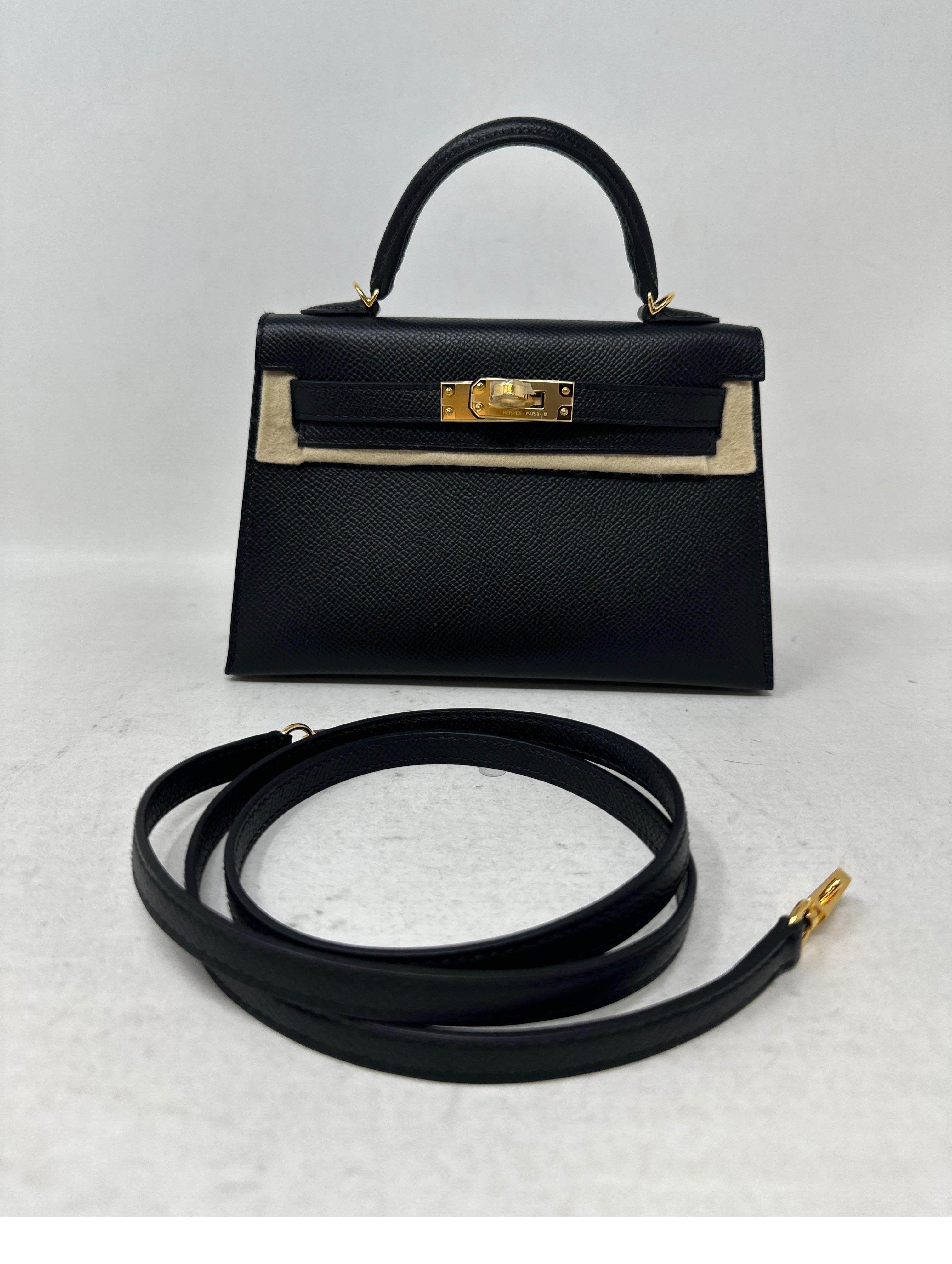 Hermes Black Mini Kelly Bag. Brand new mini Kelly in mint condition. Never used. The most wanted bag. Rare and almost impossible to get now. Gold hardware and black leather. So cute. Includes full set. Includes strap, dust bag and box. Guaranteed