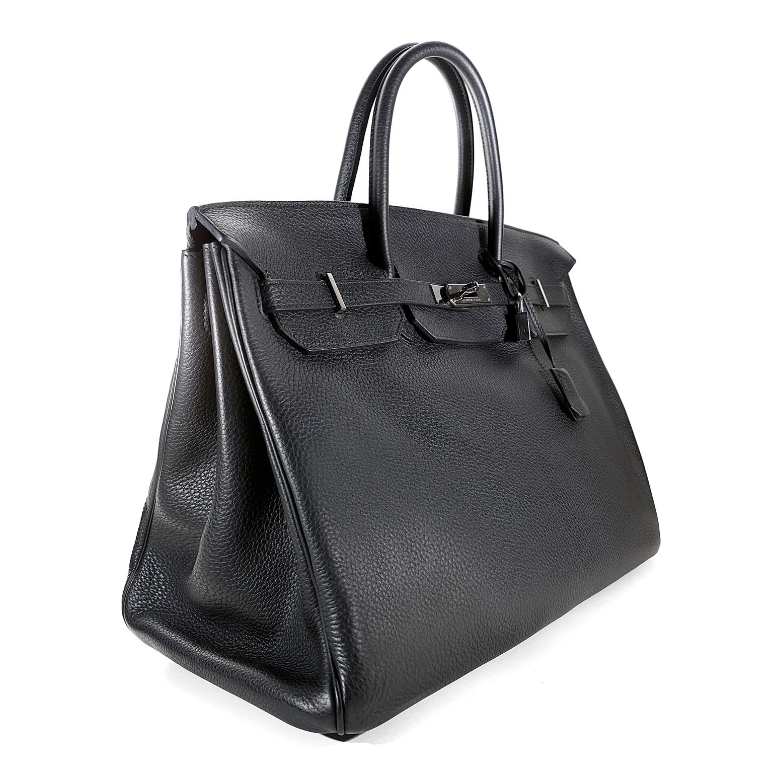 Hermès Noir Togo 40 cm Birkin- Excellent Plus Condition
Hand stitched by skilled craftsmen, wait lists of a year or more are common for the Hermès Birkin. Classic Black is perfectly paired with polished Palladium hardware in this must have Birkin.  