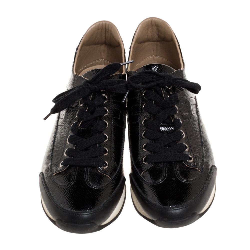 These black sneakers from Hermes are perfect for days when you wish for comfort and style! The Quick sneakers are crafted from patent leather and feature round toes, lace-ups on the vamps and tough rubber soles. They are finished with H details.

