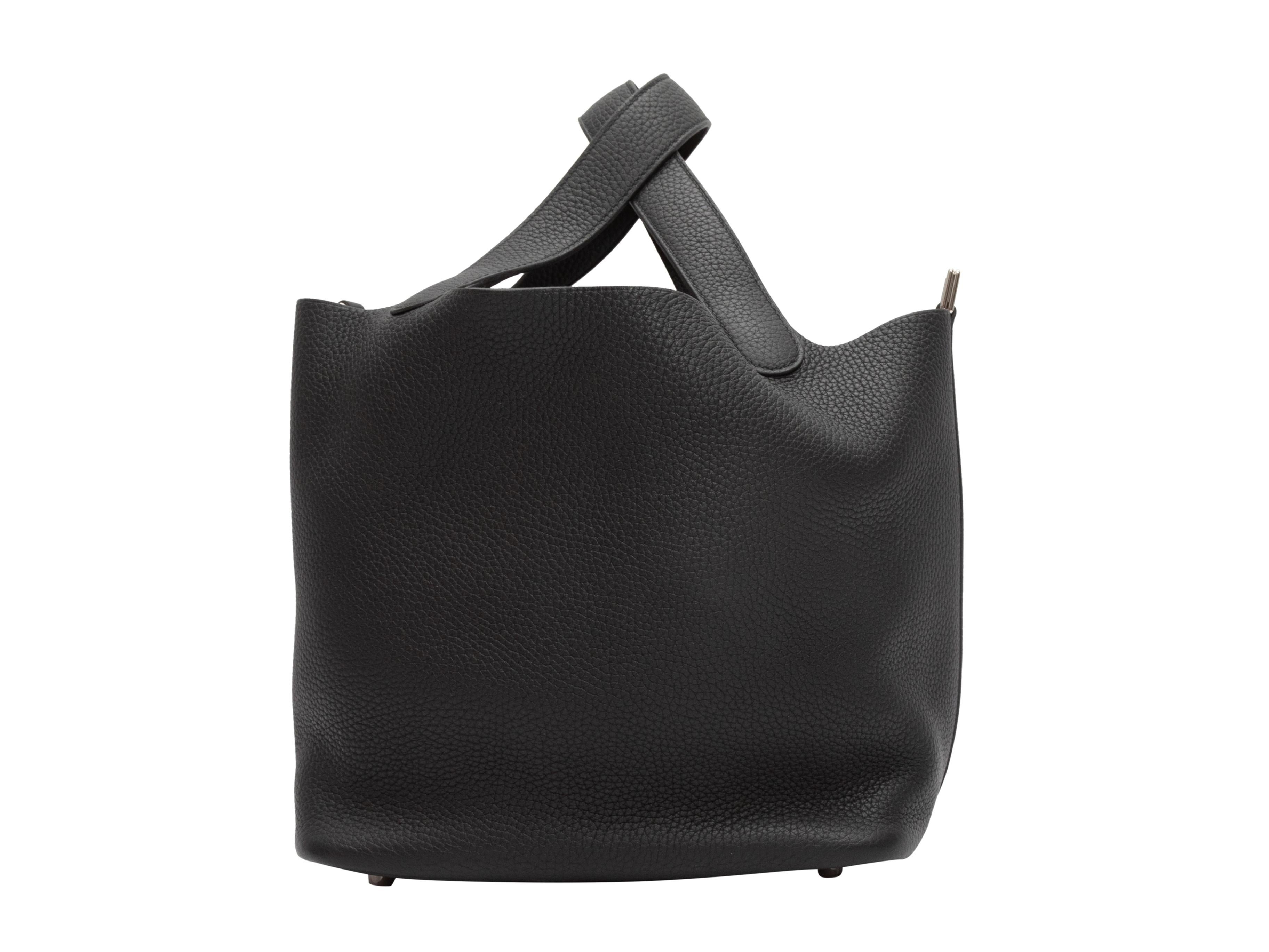 Product Details: Black Hermes Picotin Togo Leather Tote. The Picotin Togo tote features a leather body, silver-tone hardware, and dual flat top handles. 13