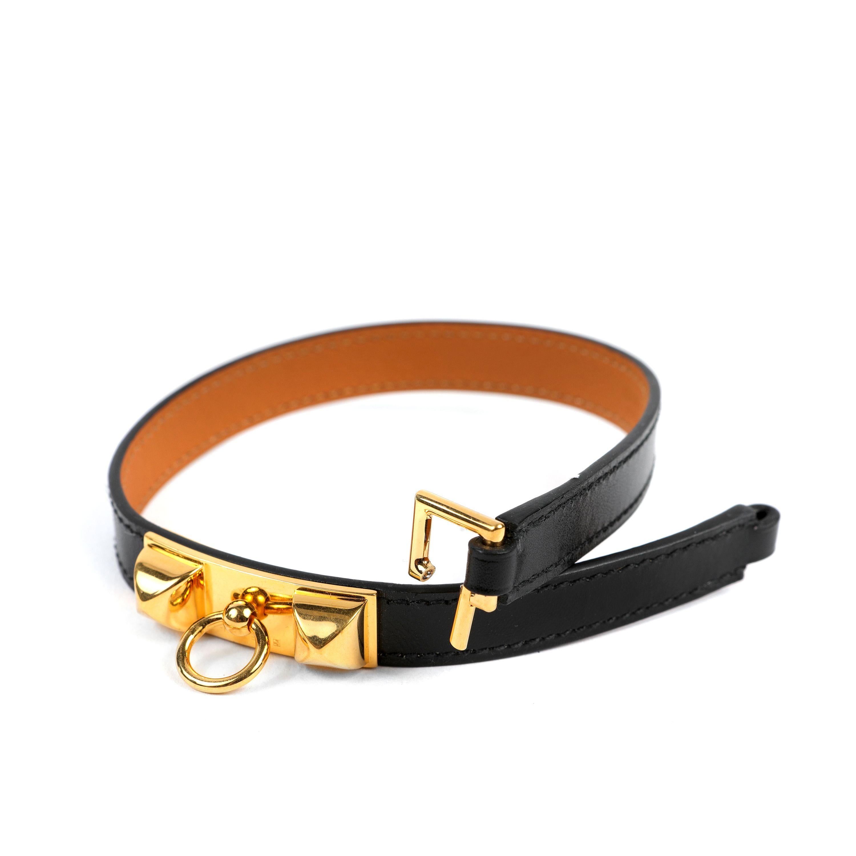 This authentic Hermès Black Rivale Double Tour Bracelet is in excellent condition.  Black leather is wrapped twice around the wrist and secured with a gold tone twist lock.

PBF 13642