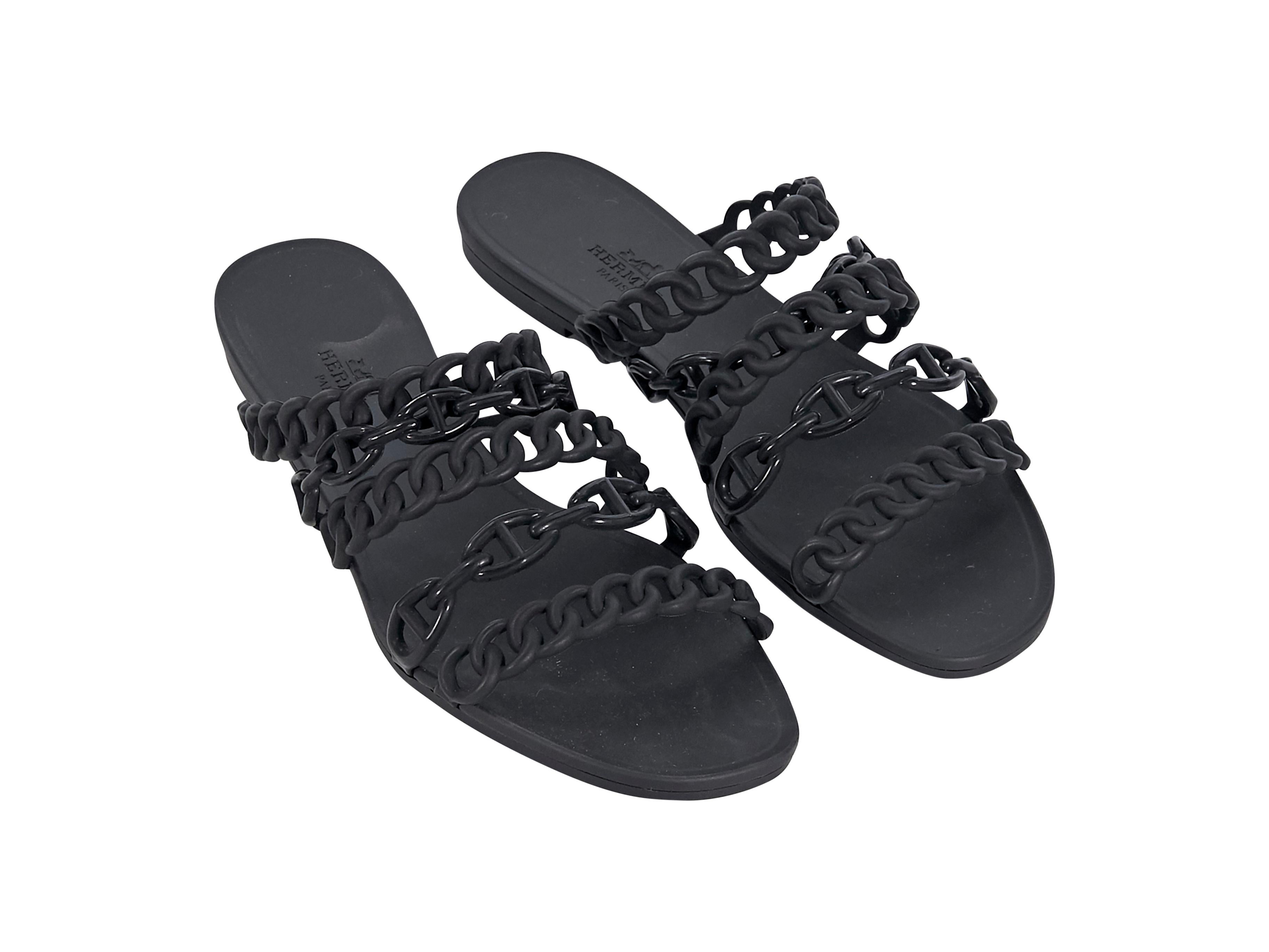 Product details:  Black rubber Chaine d'Ancre sandals by Hermes.  Faux chain straps.  Open toe.  Slide-on style. 
Condition: Pre-owned. Very good.
Est. Retail $ 950.00