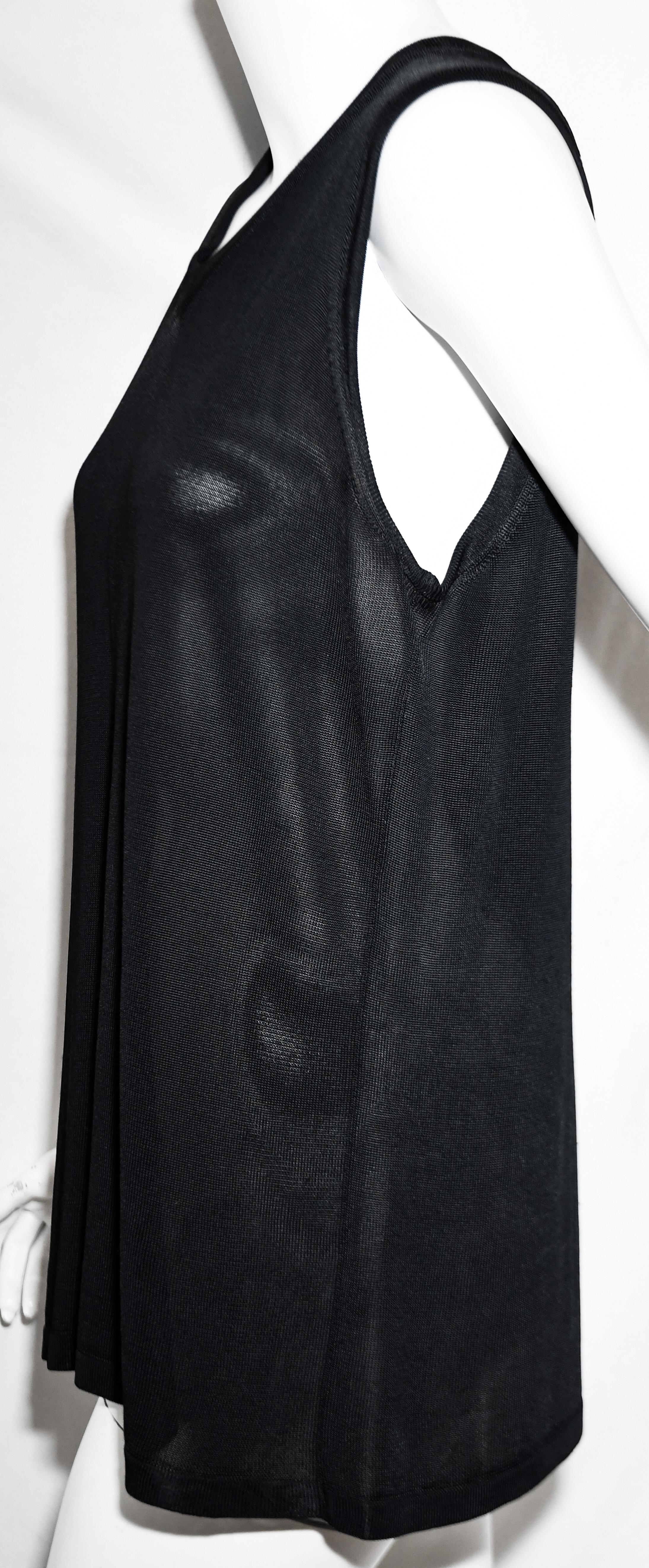 Hermes black semi sheer sleeveless V neck casual top can be worn with jeans or to complement an Hermes suit or slacks.  Casual yet sophisticated.  Top is not lined, it is in excellent condition.  Made in Italy