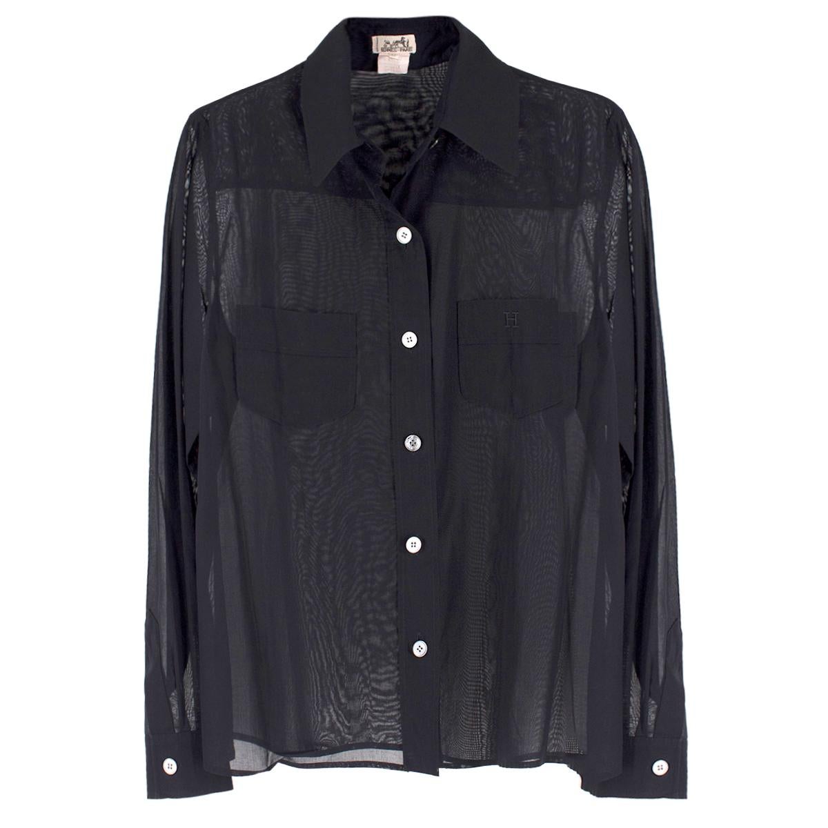 Hermes Black Sheer Classic Shirt

- Black, cotton, sheer
- Buttoned fastening closure at front and cuffs
- Point collar
- Two chest pockets, right pocket has signature logo print
- Long sleeves
-100% cotton

Please note, these items are pre-owned