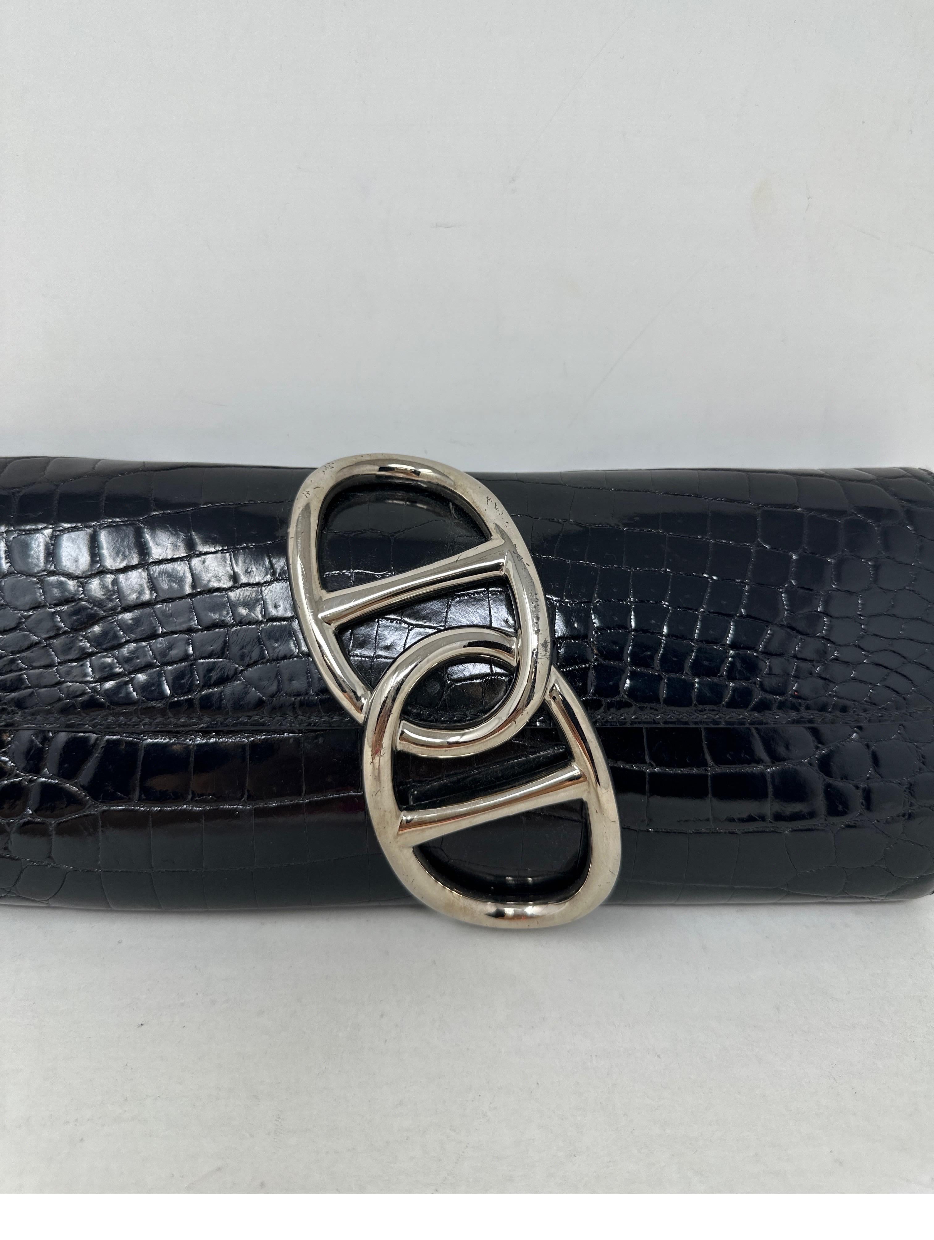Hermes Black Niloticus Shiny Crocodile Egee Clutch. Rare clutch with silver chaine d'ancre links closure. Excellent condition. Interior clean. Great evening bag and accessory. Includes dust bag. Guaranteed authentic. Add this to your Hermes