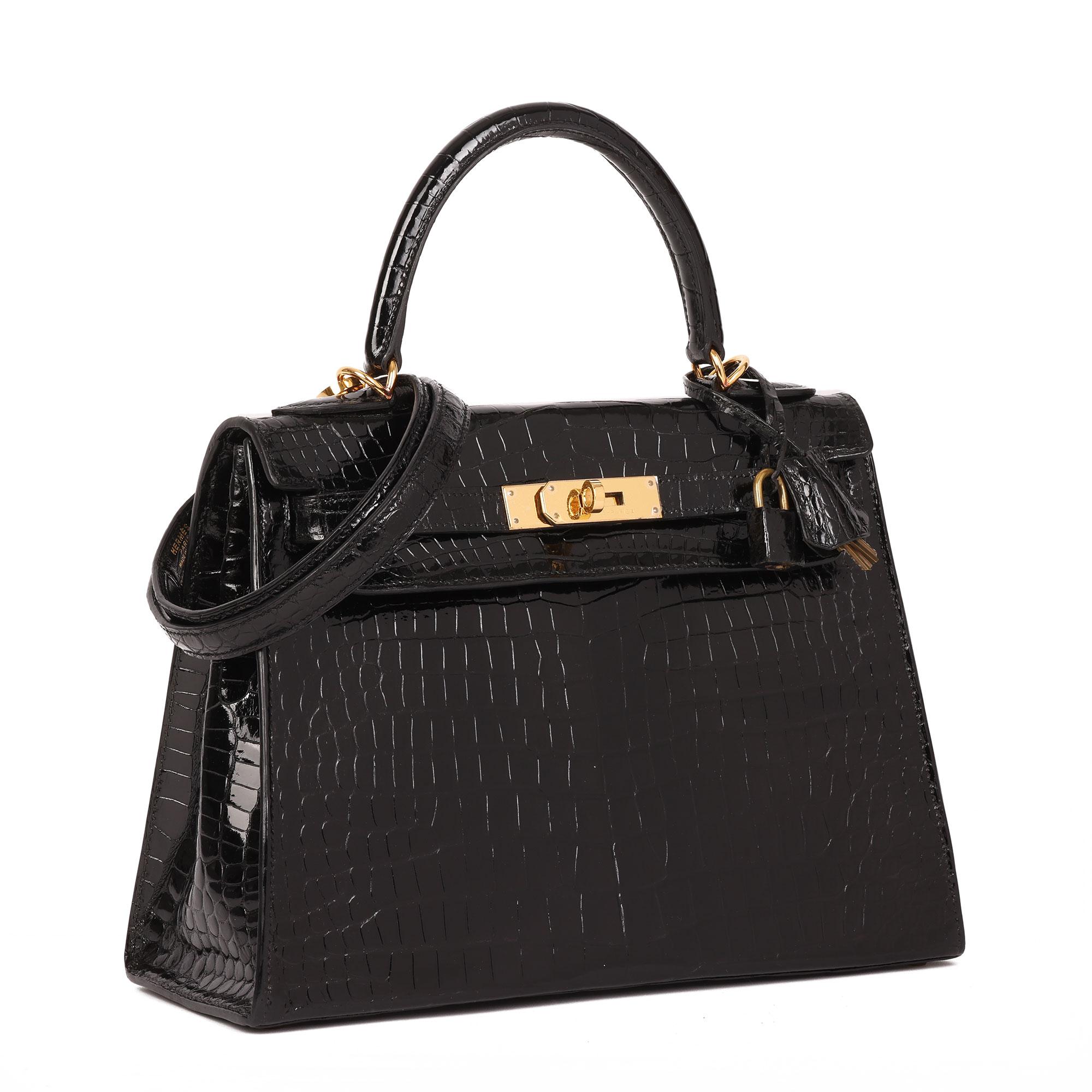 Hermès BLACK SHINY POROSUS CROCODILE LEATHER VINTAGE KELLY 28CM SELLIER

CONDITION NOTES
The exterior is in excellent condition with light signs of use.
The interior is in excellent condition with light signs of use.
The hardware is in excellent