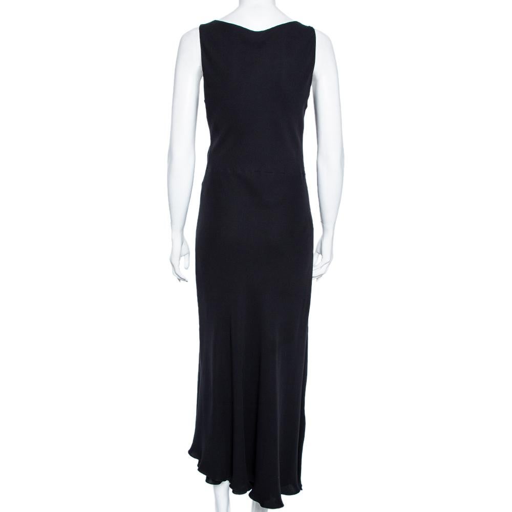 Intricately tailored into a leaner, graceful silhouette, this maxi dress from the House of Hermés will add a luxurious edge to your look. It has been finely stitched using black silk crepe fabric with a striking V-shaped neckline defining the front.