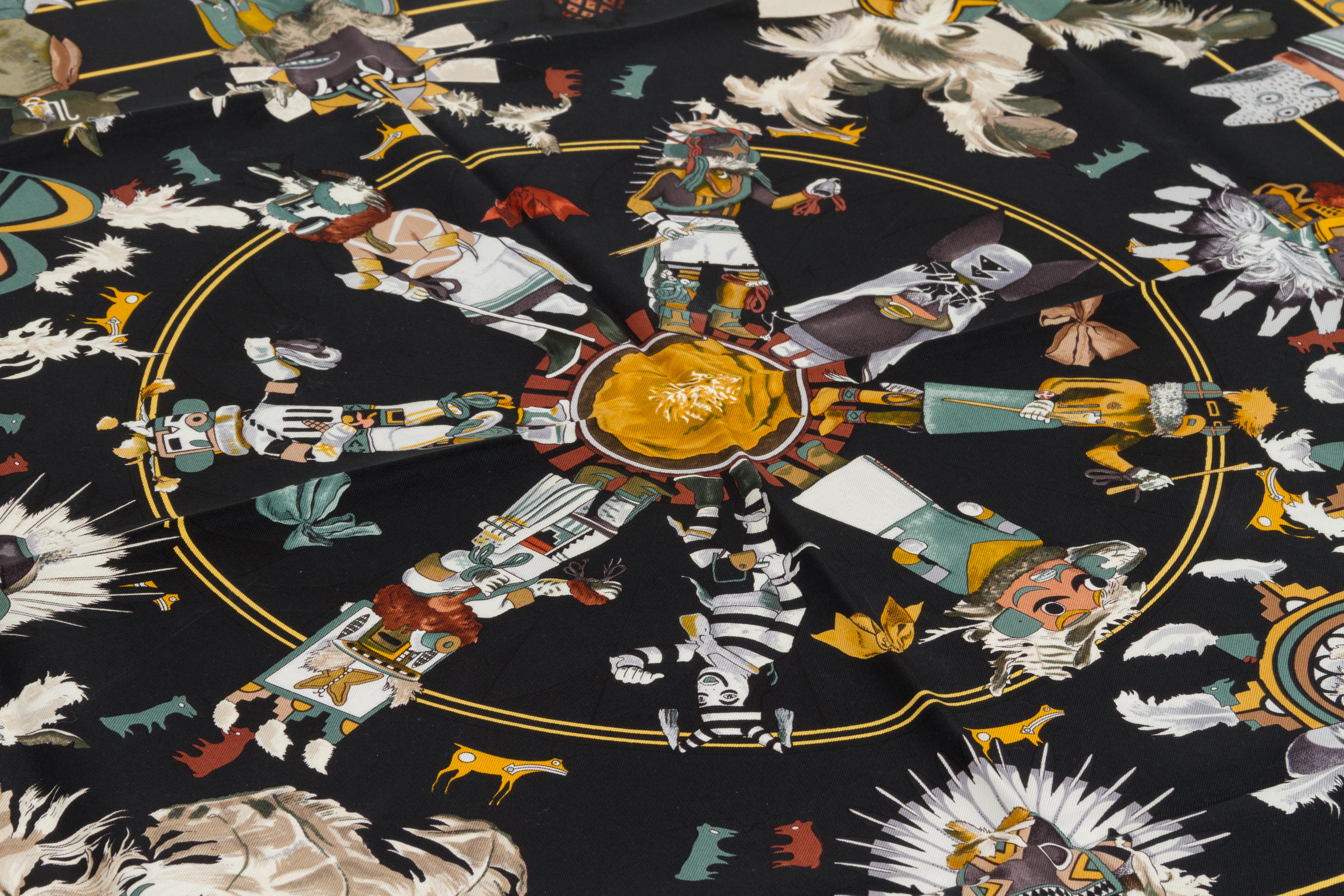 Hermès black and brown silk twill Kachinas scarf designed by Kermit Oliver. Hand-rolled edges.