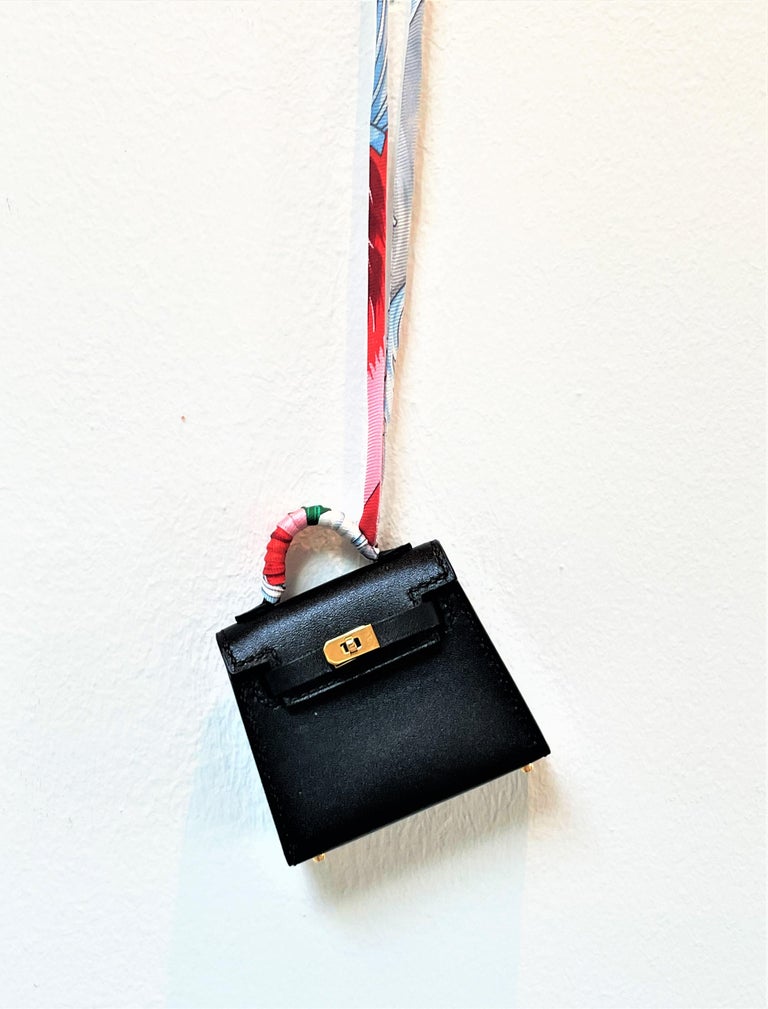 HERMÉS black Tadelakt Leather Twilly mini Kelly bag charm, gold hardware,  2021s For Sale at 1stDibs