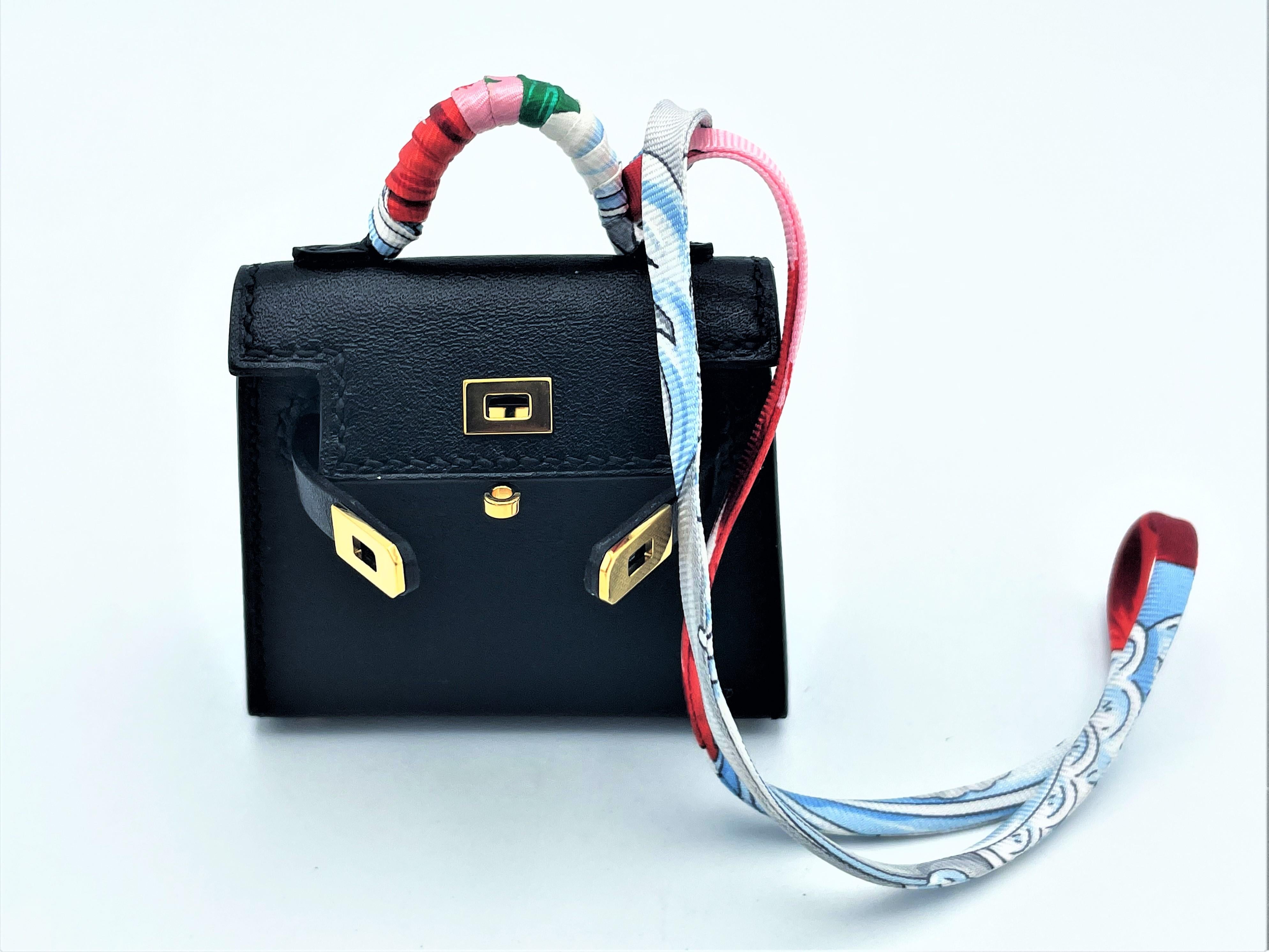 HERMÉS black Tadelakt Leather Twilly mini Kelly bag charm, gold hardware,  2021s For Sale 1