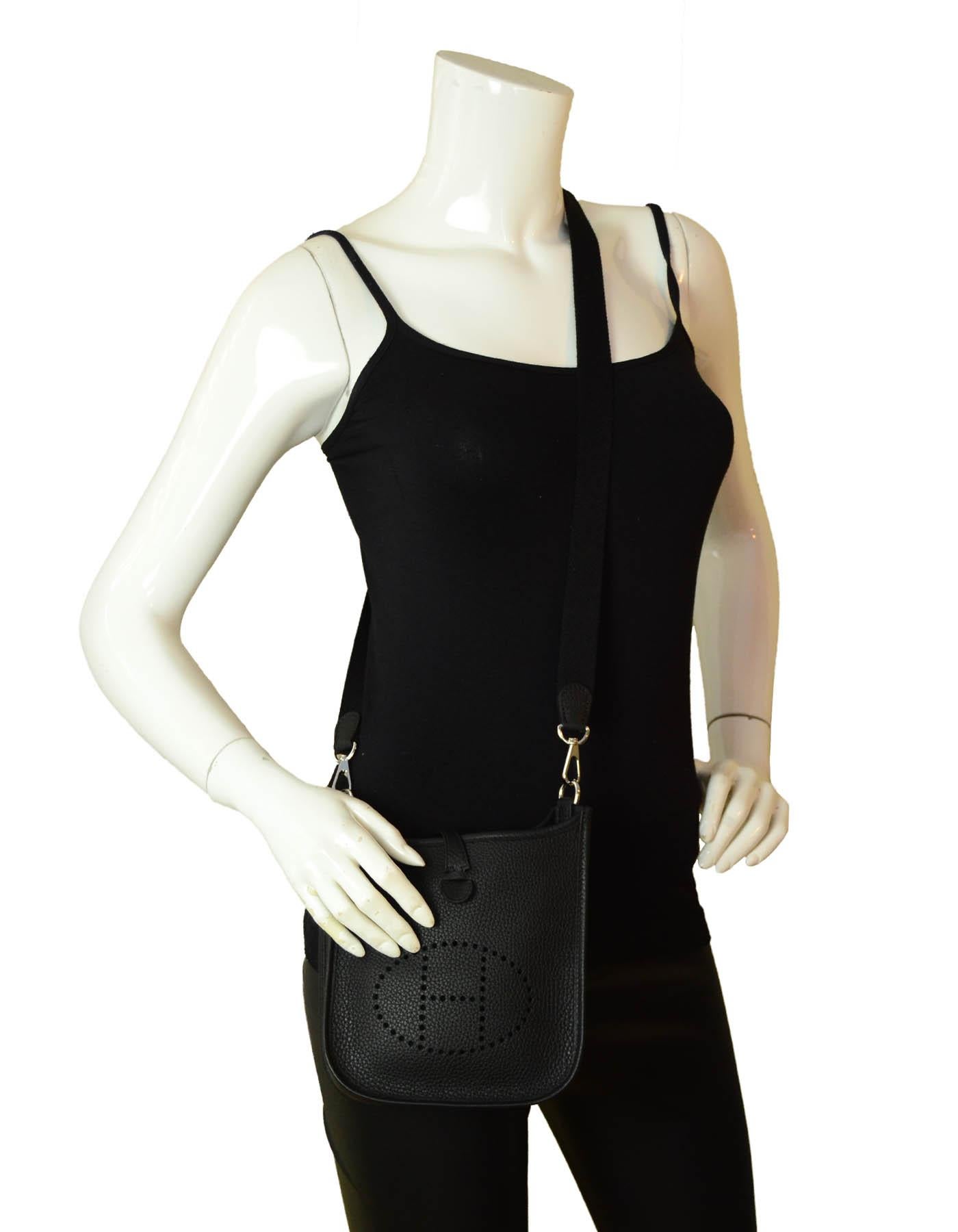 Hermes Black Taurillon Clemence Leather Evelyne TPM Crossbody Bag

Made In: France
Year of Production: 2020
Color: Black
Hardware: Silvertone palladium
Materials: Clemence leather
Lining: Suede
Closure/Opening: Open top with middle snap