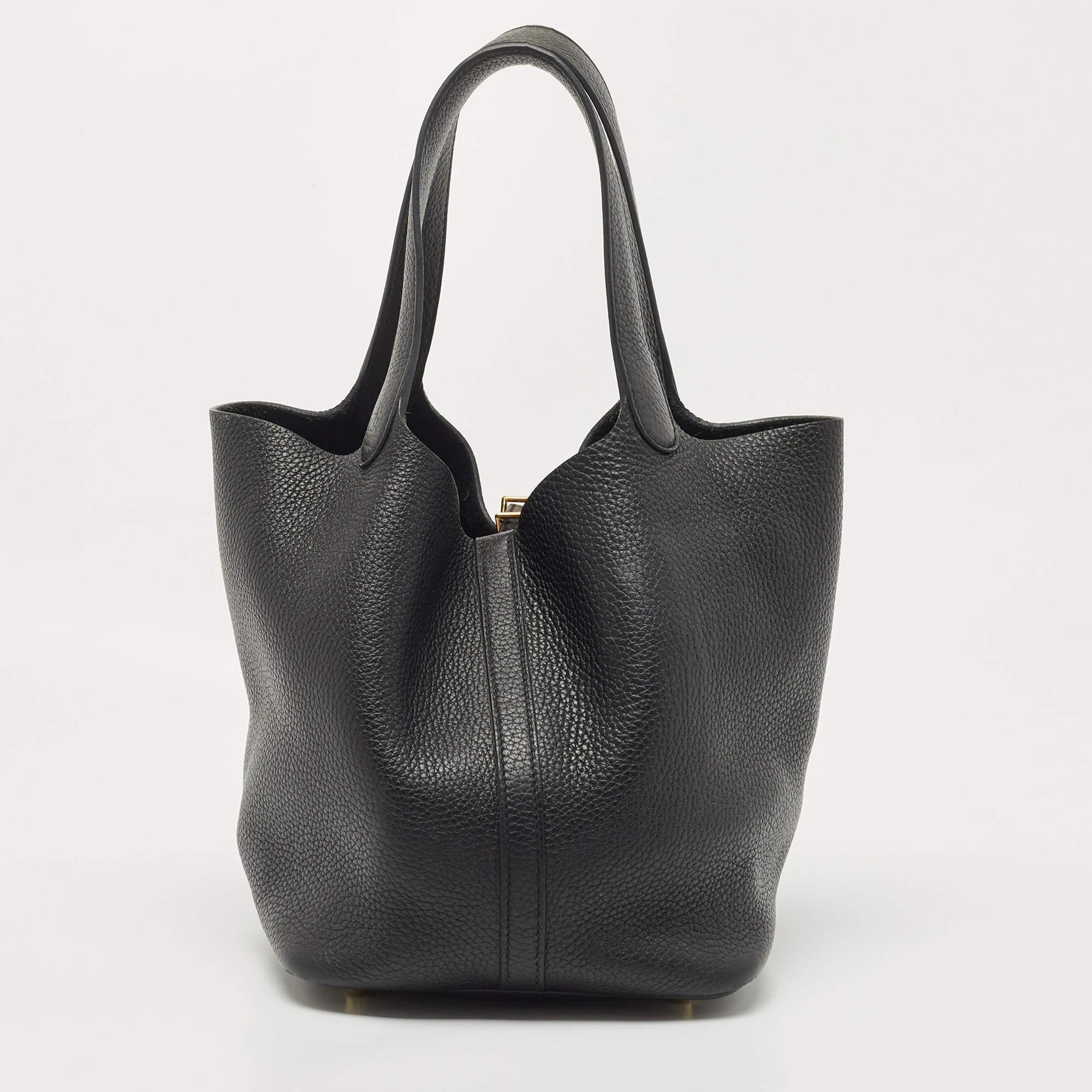 Wonderfully crafted from leather, this Picotin from Hermes is a creation for people who love a perfect blend of luxury and style. It comes in a classy hue, and it sits in a relaxed shape with two handles and a spacious interior. Armed with