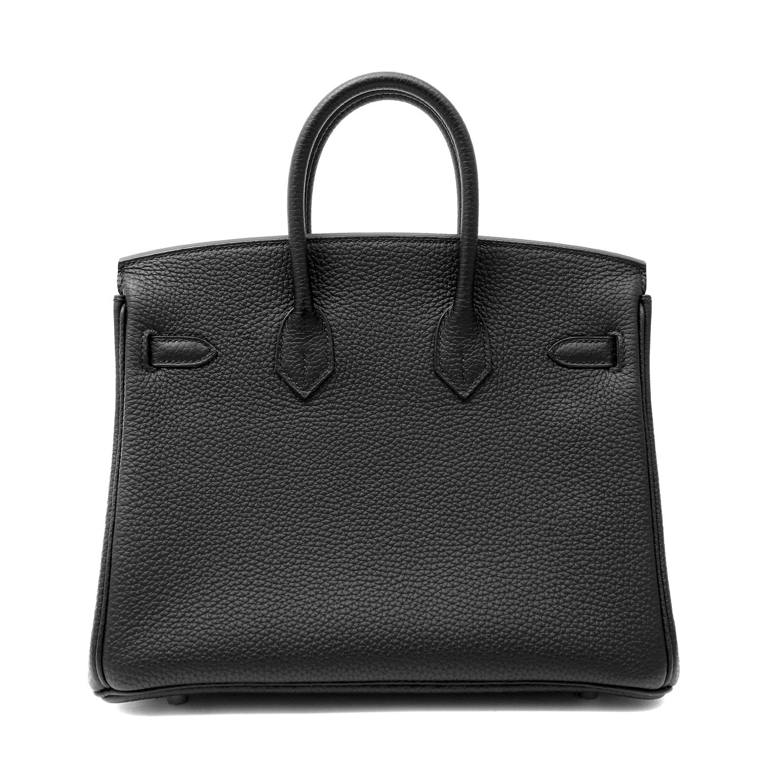 This authentic Hermès Black Togo 25 cm Birkin is in pristine condition with the protective plastic intact on the hardware.  The smaller silhouette of the Birkin is demure and ladylike.  It is in extremely high demand.
Black Togo leather is textured