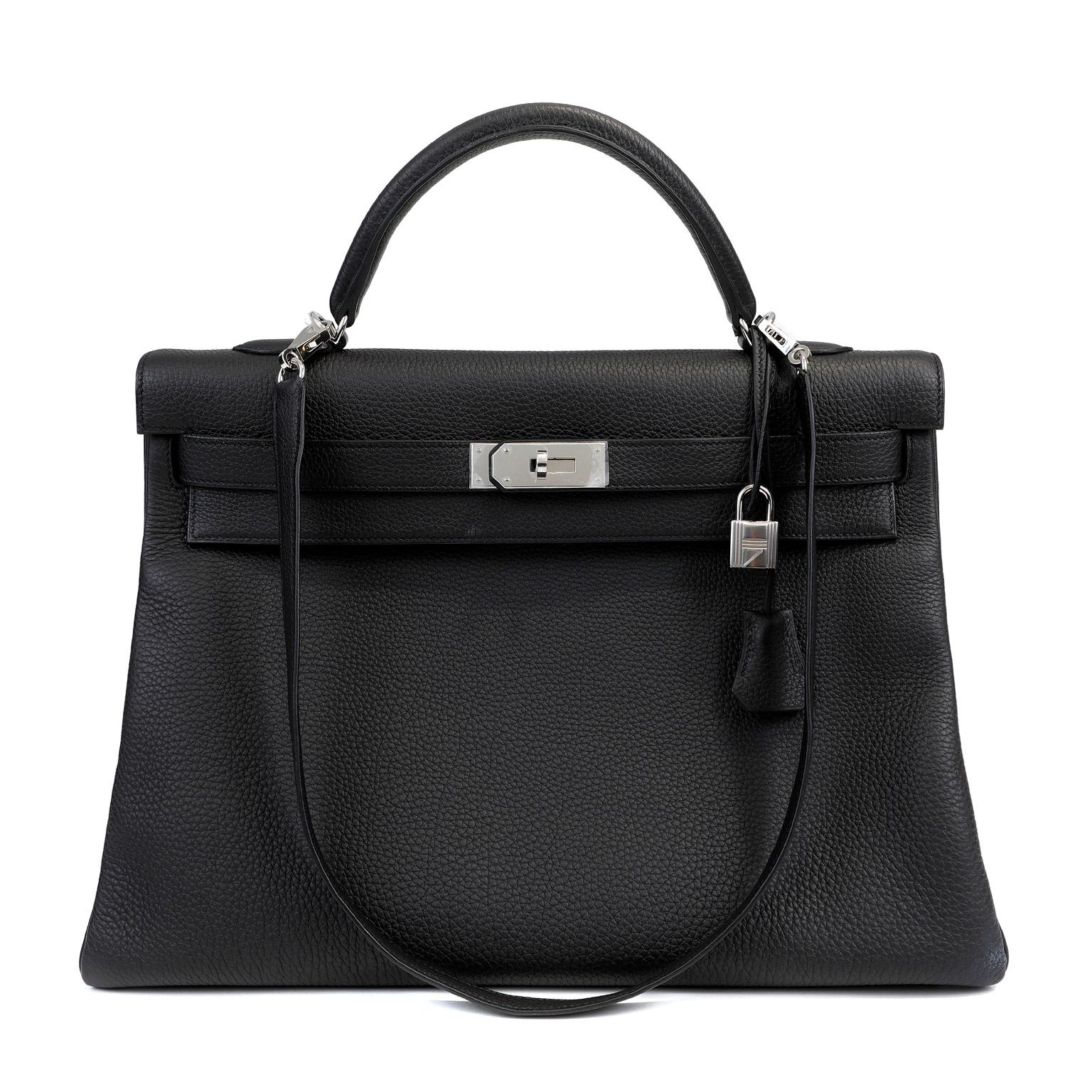 This authentic Hermès Black Togo 40 cm Kelly is in pristine condition.  The protective plastic remains intact on the hardware.   Hermès bags are considered the ultimate luxury item worldwide.  Each piece is handcrafted with waitlists that can exceed