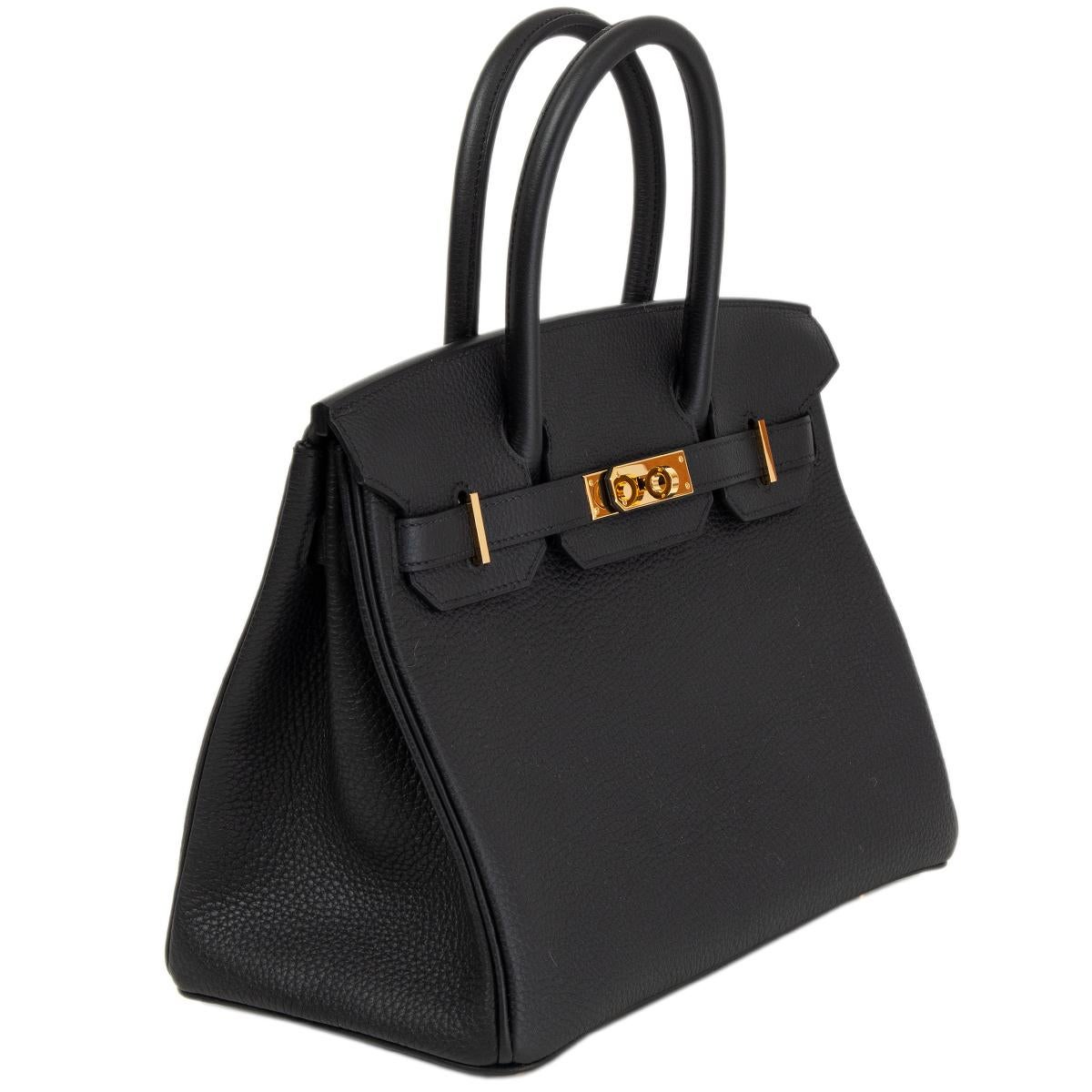 100% authentic Hermès Birkin 30 bag in Noir (black) Togo leather with gold-plated hardware. Lined in Chevre (goat skin) with an open pocket against the front and zipper pocket against the back. Brand new. Comes with full