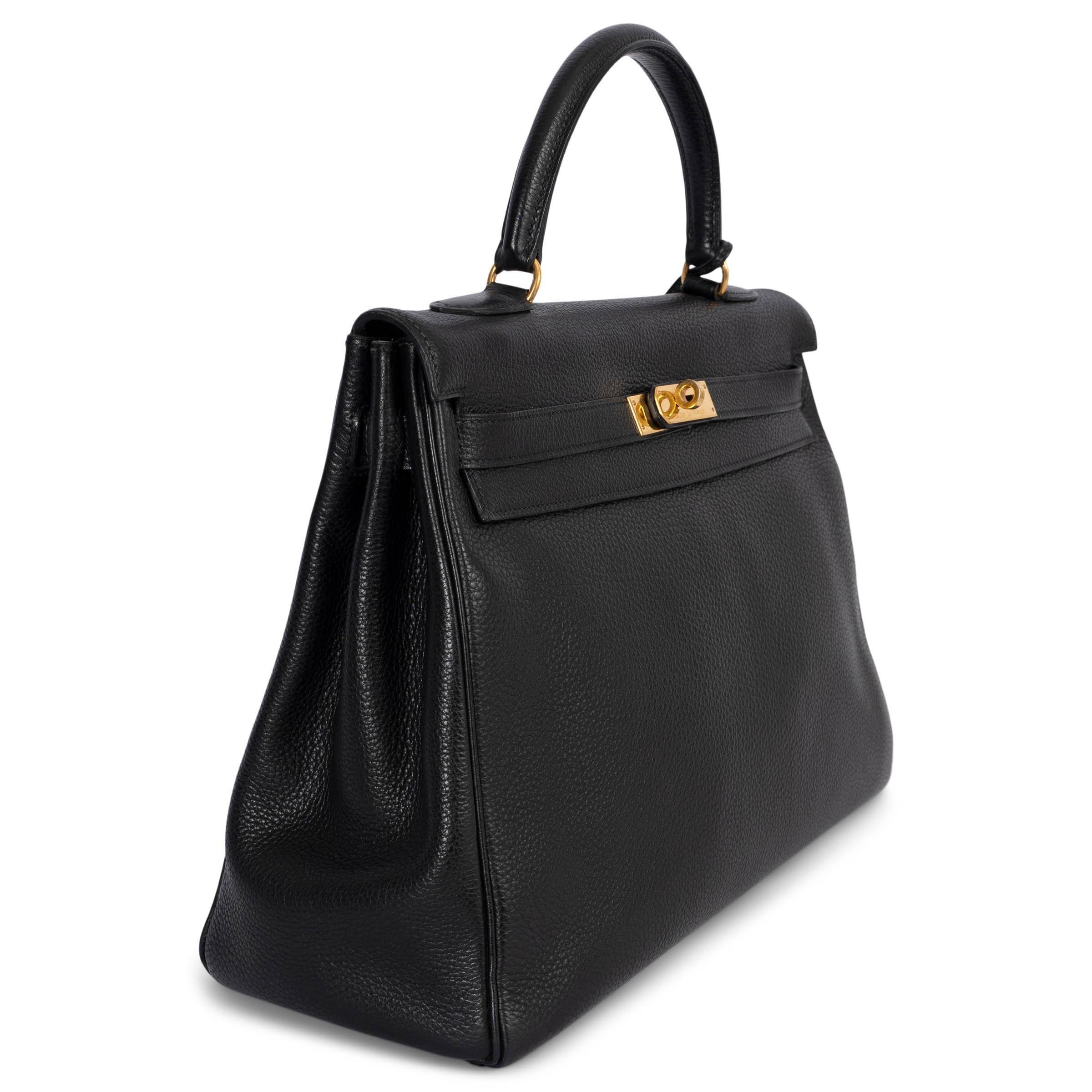 100% authentic Hermès Kelly II 35 bag in black Veau Togo leather with gold-plated hardware. Lined in black chèvre (goatskin) with a zipper pocket against the back and divided patch pocket against the front. Has been carried and shows faint wear to