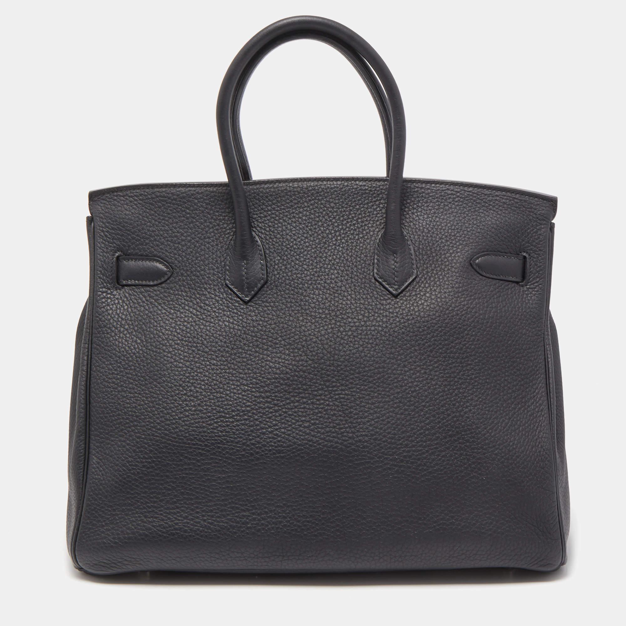 If you've been wishing to own an authentic Birkin bag, there is no better time to buy the coveted work of art than now. Here, we have this black Togo Birkin 35 just for you. Crafted in France from Togo leather, the bag features dual top handles and