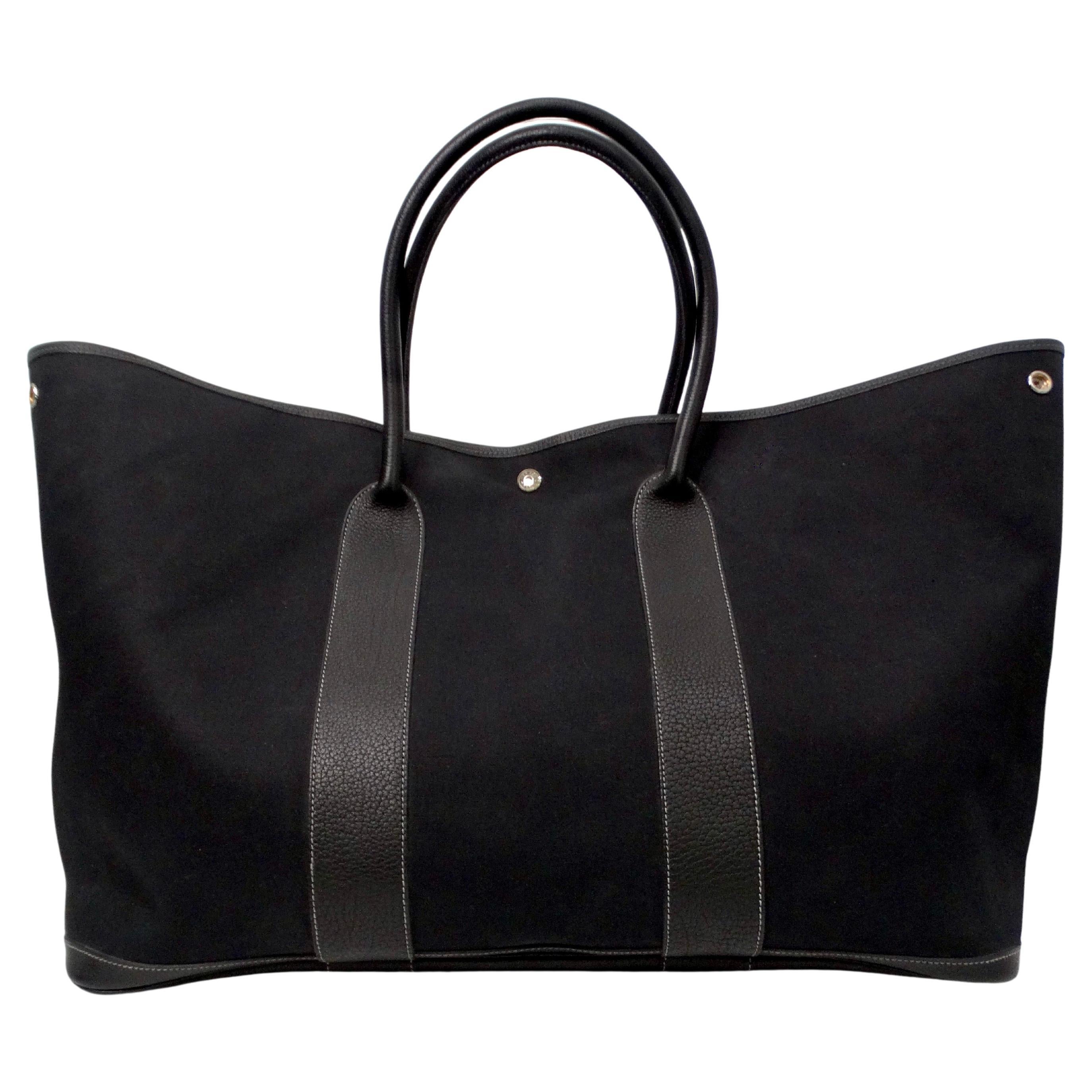 The Hermes Black Toile & Negonda Garden Party 39 Tote Bag is a sophisticated and versatile accessory that embodies timeless elegance and practicality. Crafted from luxurious black toile fabric accented with Negonda leather details, this tote exudes