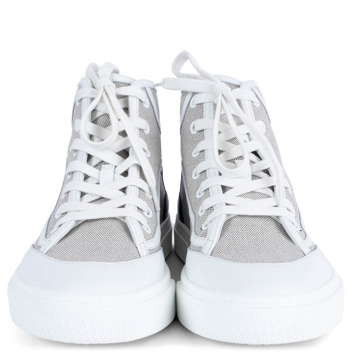 100% authentic HHermès Get Up high-top sneakers in black and white H canvas. Feature signature 