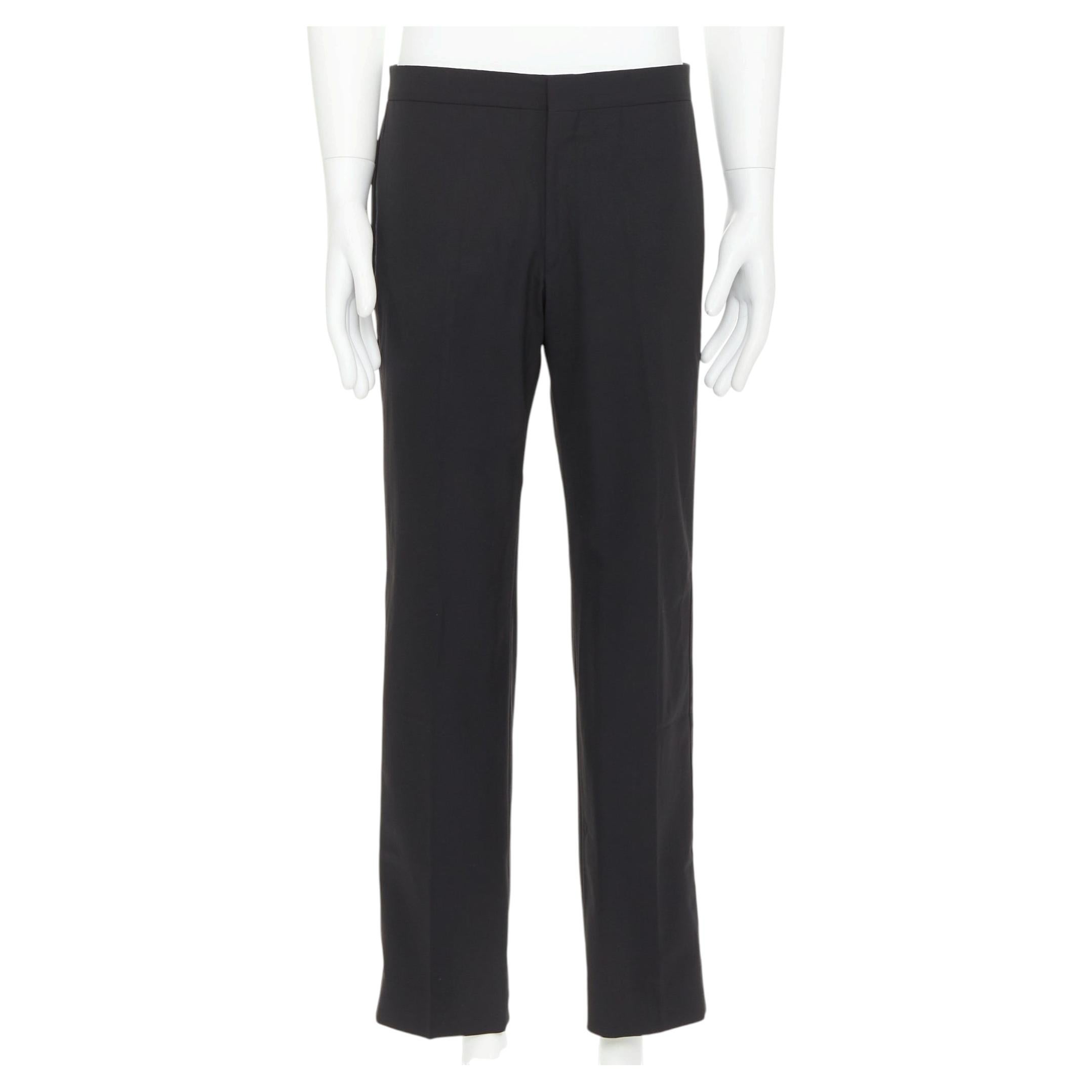 HERMES - Pantalon taille moyenne en laine mélangée noire, bordé de satin et cousu main sur le côté IT50 XL