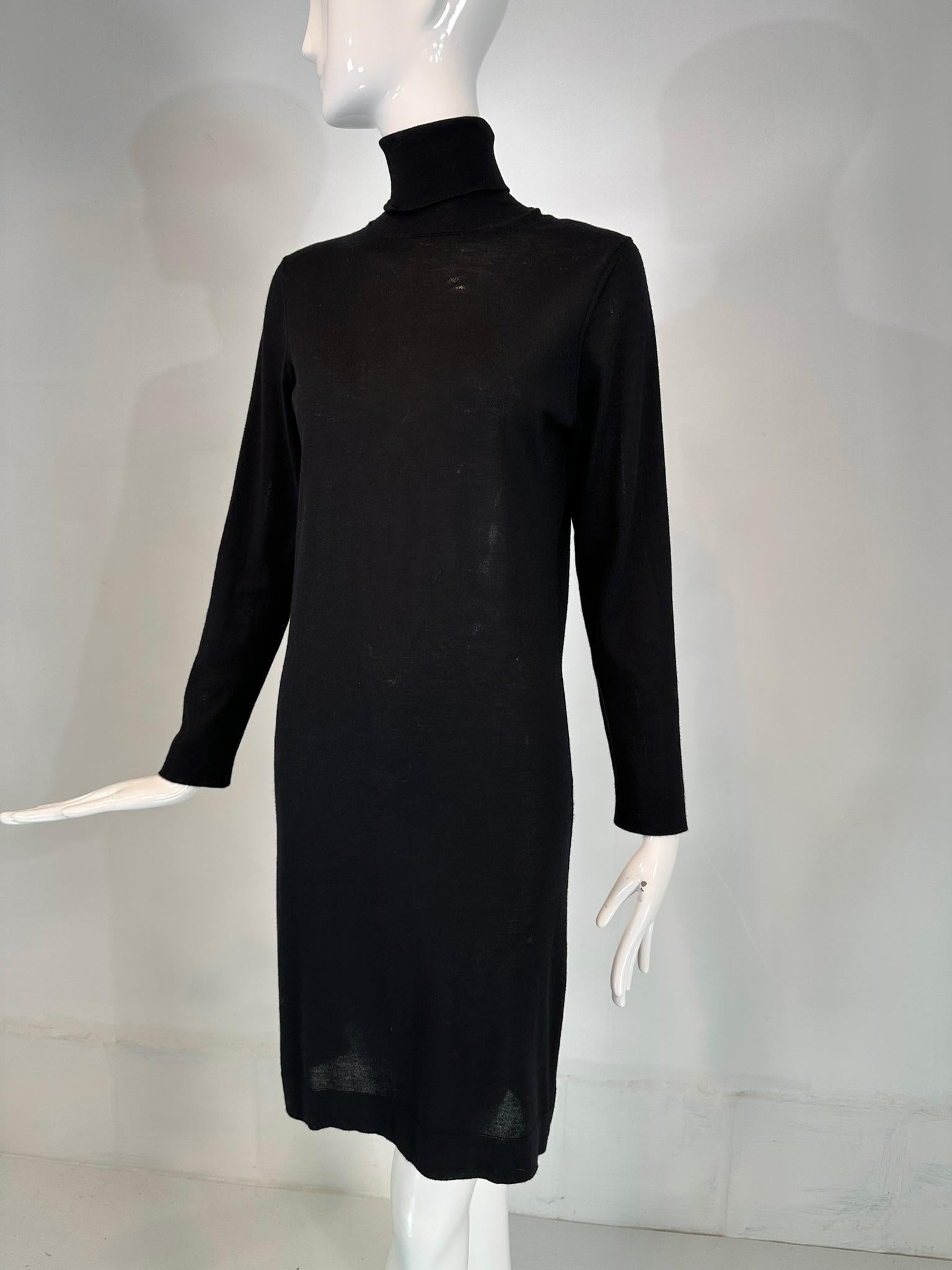 Hermes black wool silk blend knit, long sleeve, pull on dress, marked size small. Pull on dress has a turtleneck, long sleeves with hemmed cuffs, the dress skims the body. Unlined, the dress is translucent. Fits like a size small. In very good pre