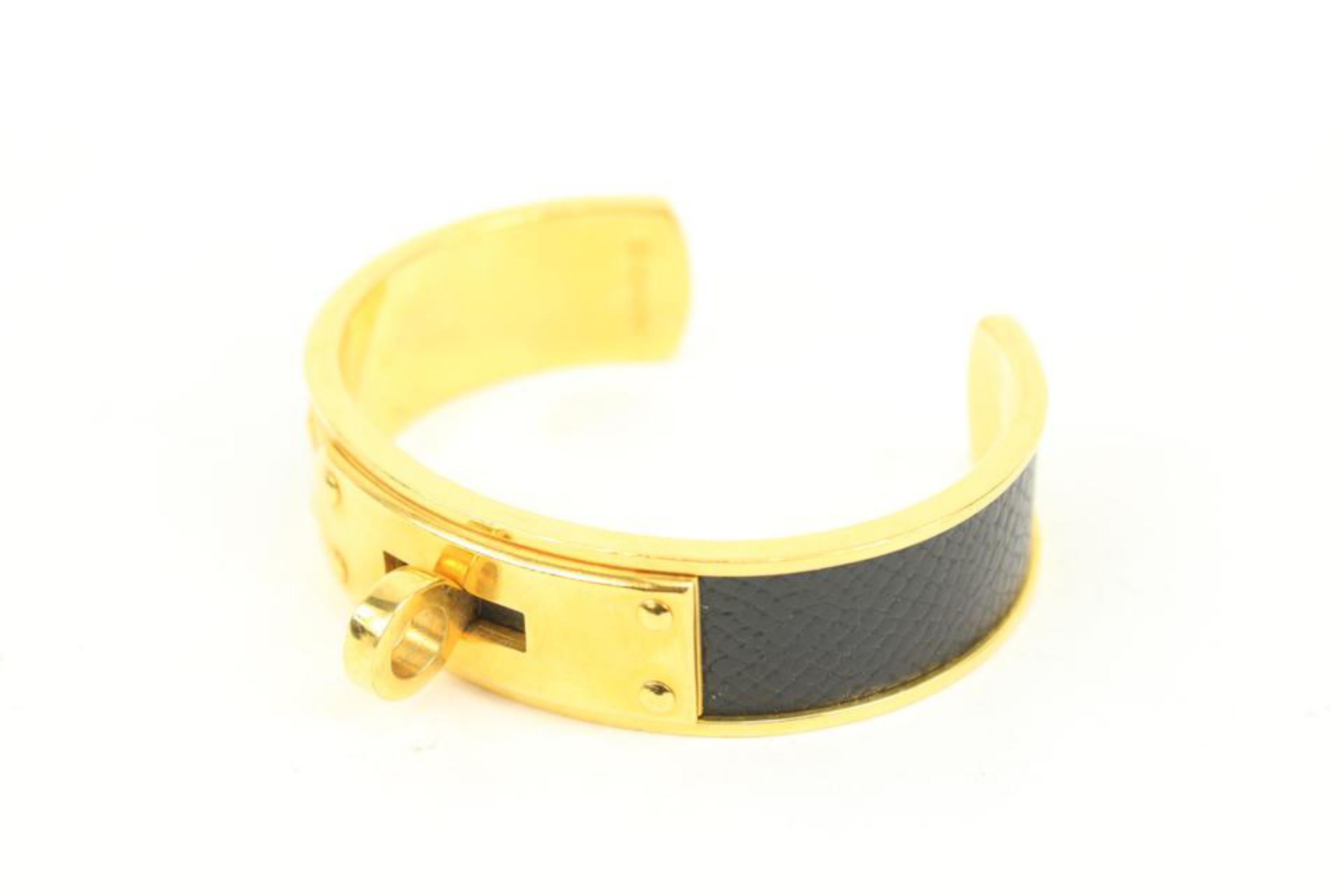 Hermès Black x Gold Kelly Cuff Bangle s331h40
Measurements: Length:  2.3