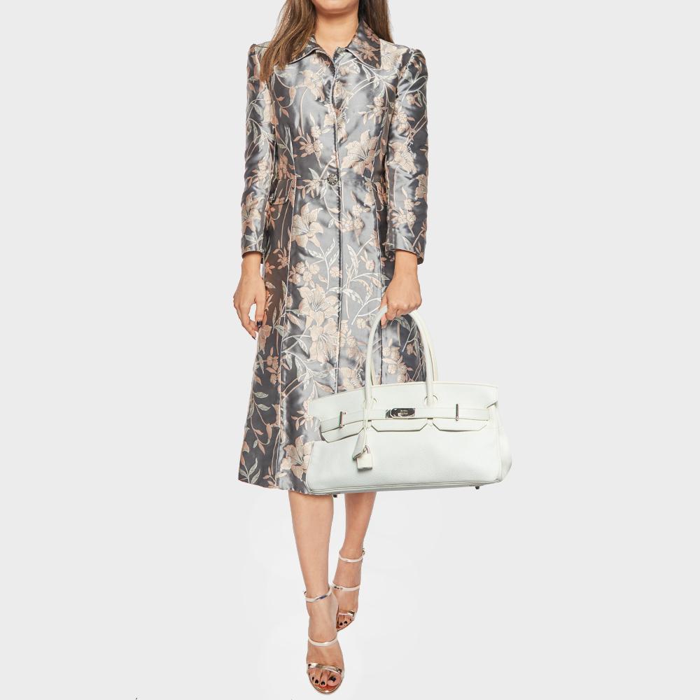 Crafted by Hermès, the Birkin JPG 42 Bag exudes timeless charm. Its supple texture and impeccable stitching showcase luxury. With its sleek palladium hardware and versatile shoulder strap, it seamlessly blends practicality with exquisite design,
