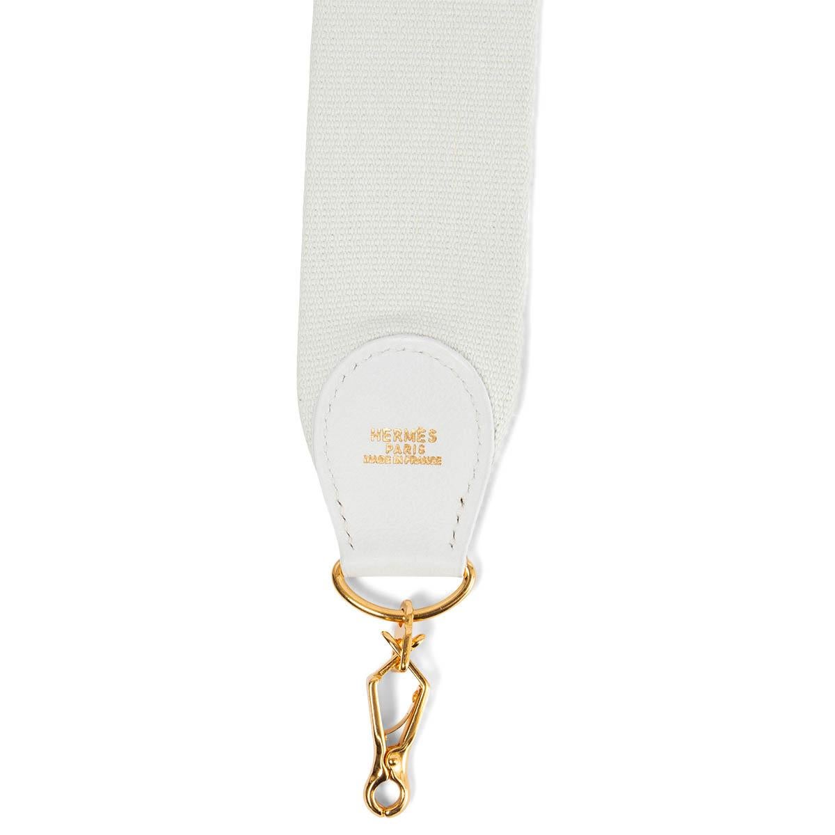 100% authentic Hermès shoulder strap for your Kelly or Evelyne bag in Blanc white canvas and Gulliver leather. Has been carried and is in excellent condition.

Measurements
Width	5cm (2in)
Length	110cm (42.9in)
Hardware	Gold-Tone

All our listings