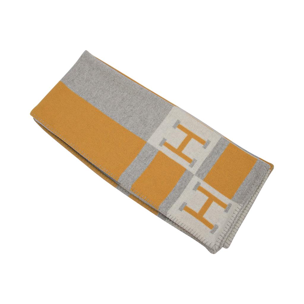 Guaranteed authentic Hermes Avalon Bayadere blanket features Jaune, Gris and Ecru.
Created from 90% Merino Wool and 10% cashmere and has whip stitch edges.
Comes with signature Hermes box.
New or Pristine Store Fresh Condition. 
**Please see the 2