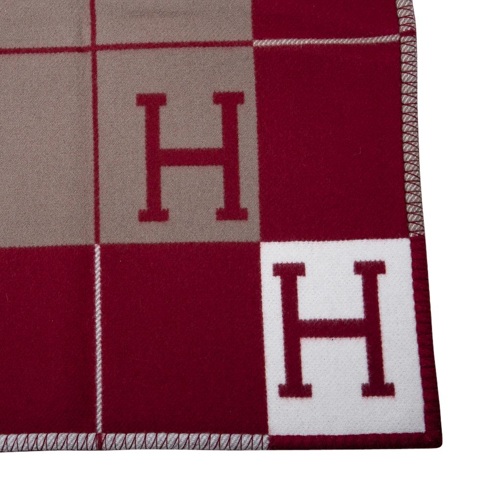 Guaranteed authentic Hermes Avalon blanket featured in Rouge H.
Created from 90% Merino Wool and 10% cashmere and has whip stitch edges.
New or Pristine Store Fresh Condition. 
**Please see the matching throw pillow / cushion listed separately.**   