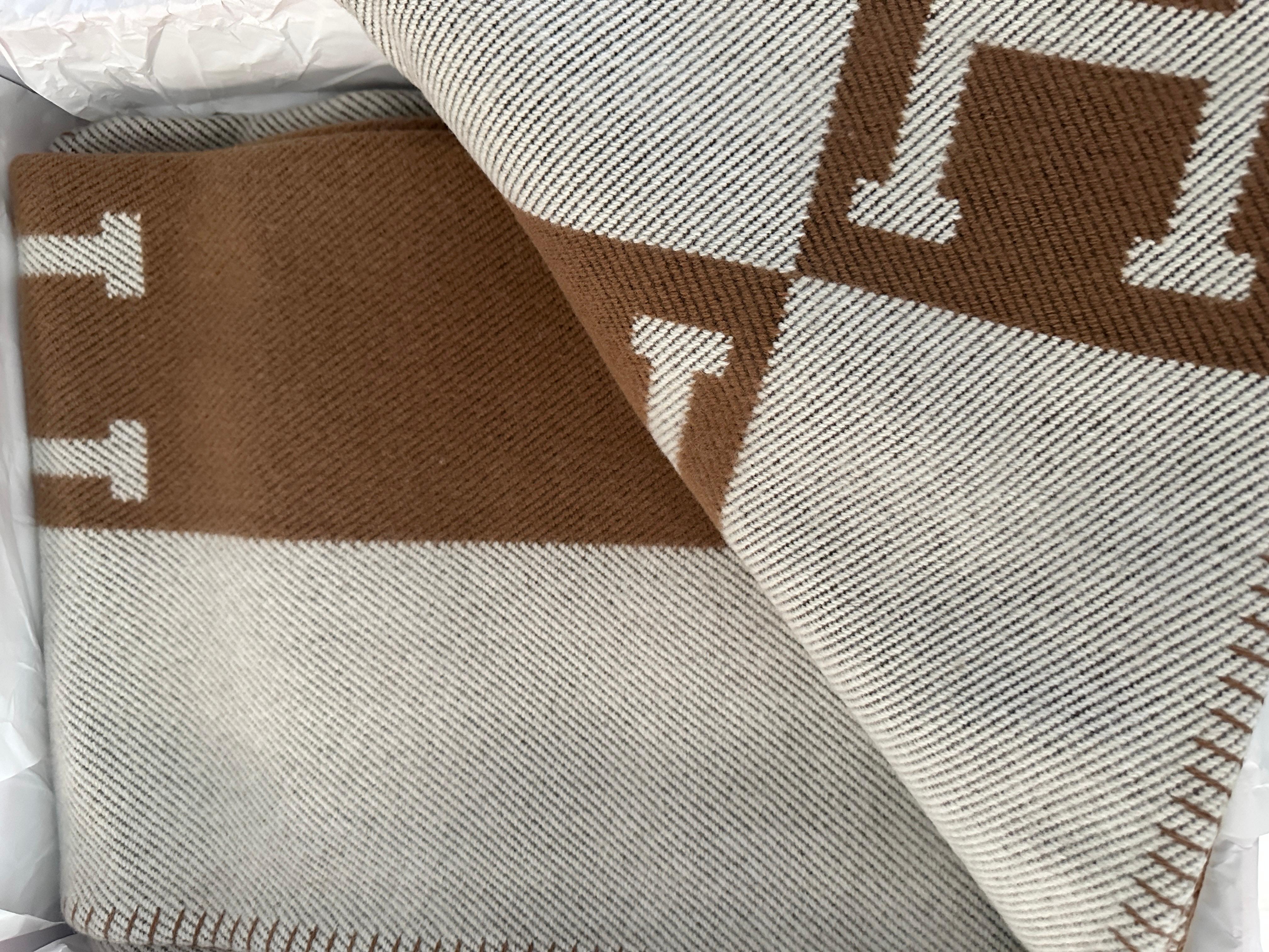 Hermes Avalon Blanket Throw

Color is Ecru and Camel

Brand New
Make a statement in any room with this blanket 
Taken out for photos only
Hermes throw blanket (90% merino wool, 10% cashmere)
Approx Measures 53