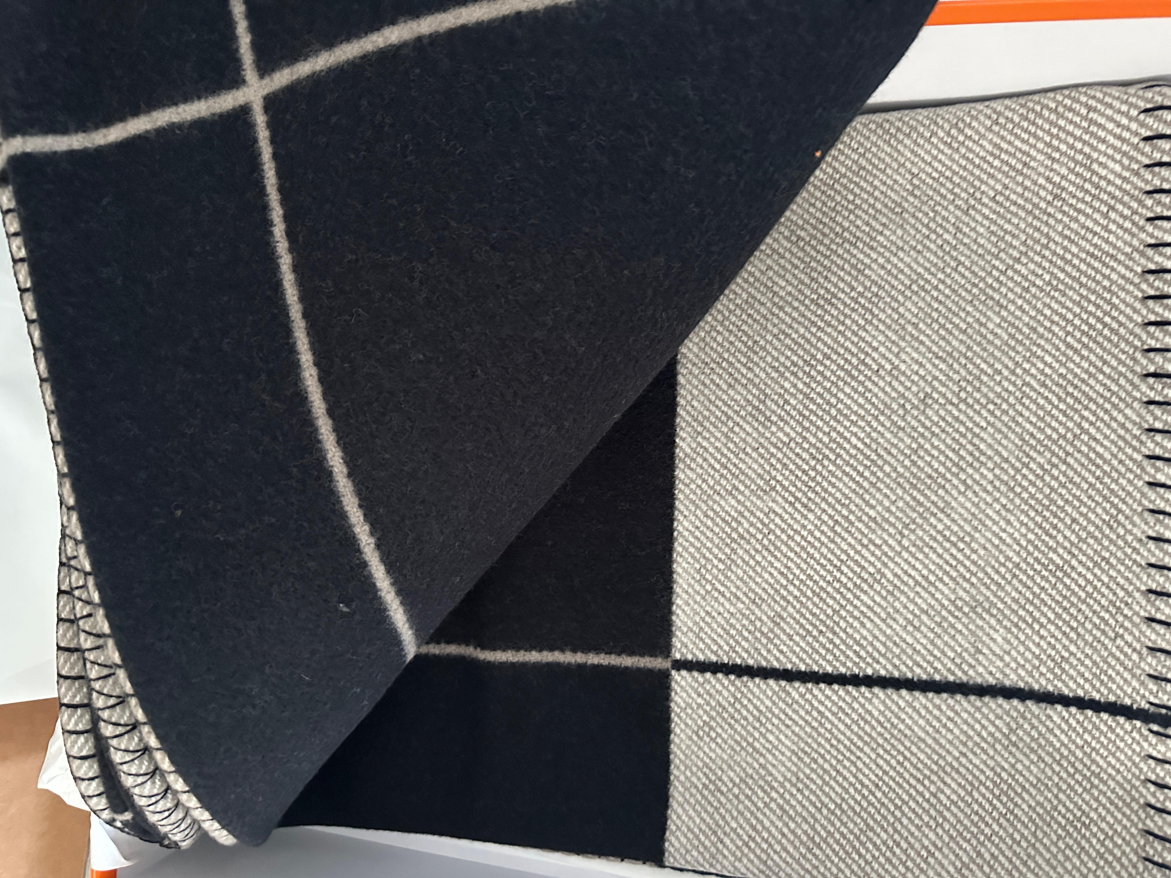 Hermes Avalon Blanket Throw

Color is Ecru and Noir

Brand New
Make a statement in any room with this blanket 
Taken out for photos only
Hermes throw blanket (90% merino wool, 10% cashmere)
Approx Measures 53