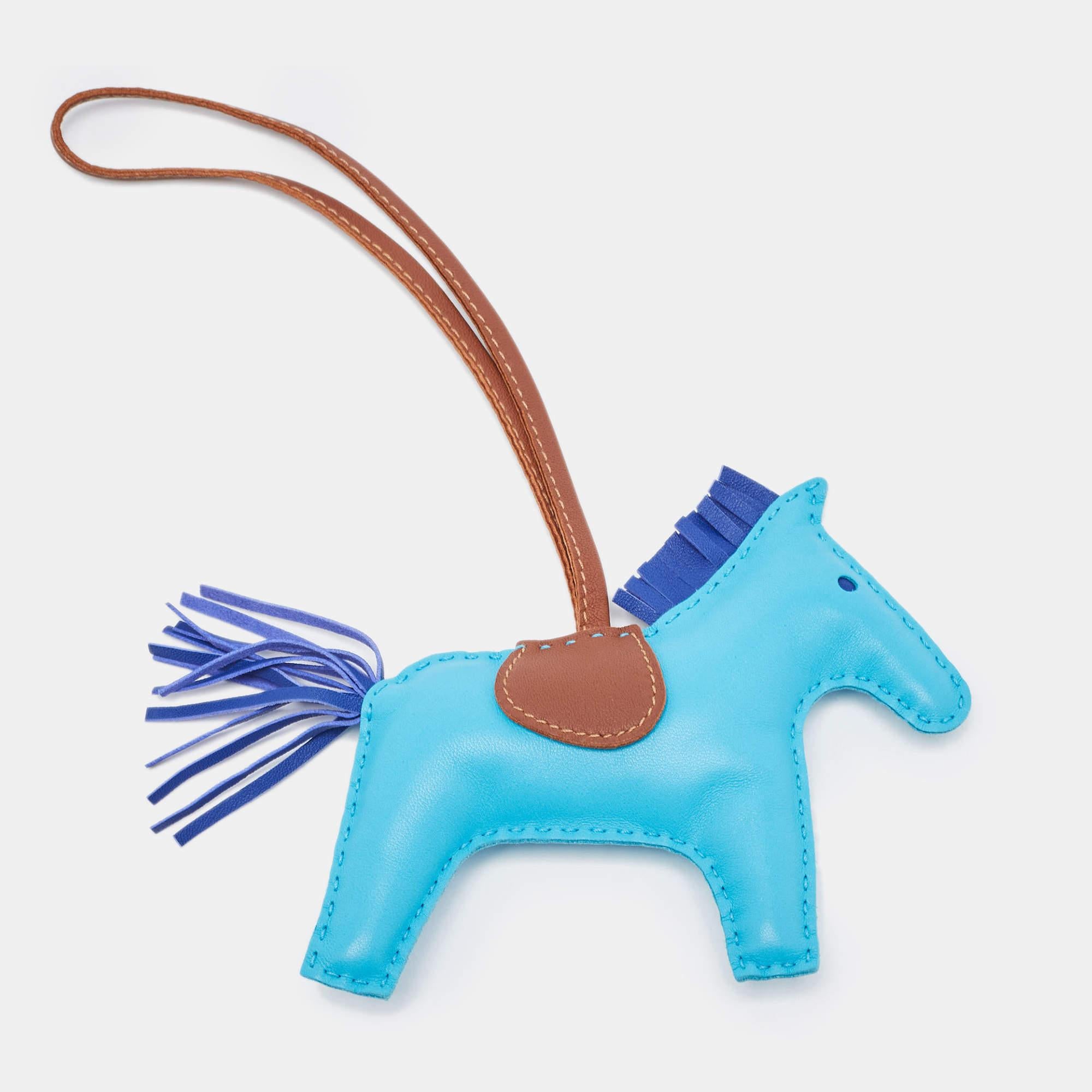 Collected by fans of Hermès and handbags alike, these little galloping charms are dream pieces to dress up one's precious possessions. Hermès pays homage to its equestrian design heritage with this Rodeo Horse. The horse is made using leather of