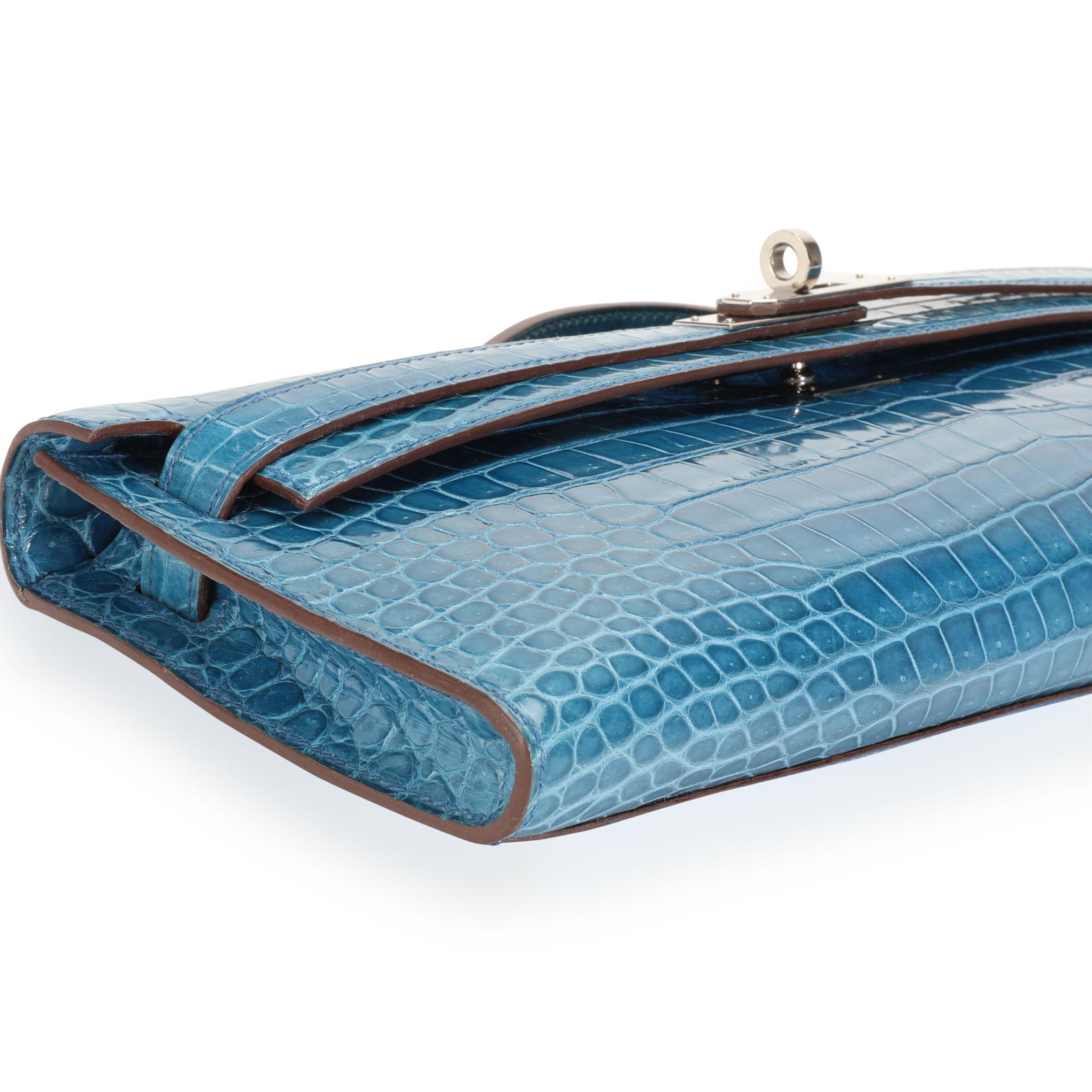  Hermès Bleu Brighton Shiny Porosus Crocodile Kelly Cut PHW
SKU: 111554
MSRP:  
Condition: Pre-owned (3000)
Condition Description: 
Handbag Condition: Very Good
Condition Comments: Very Good Condition. Scratching to hardware. Light marks to skin.