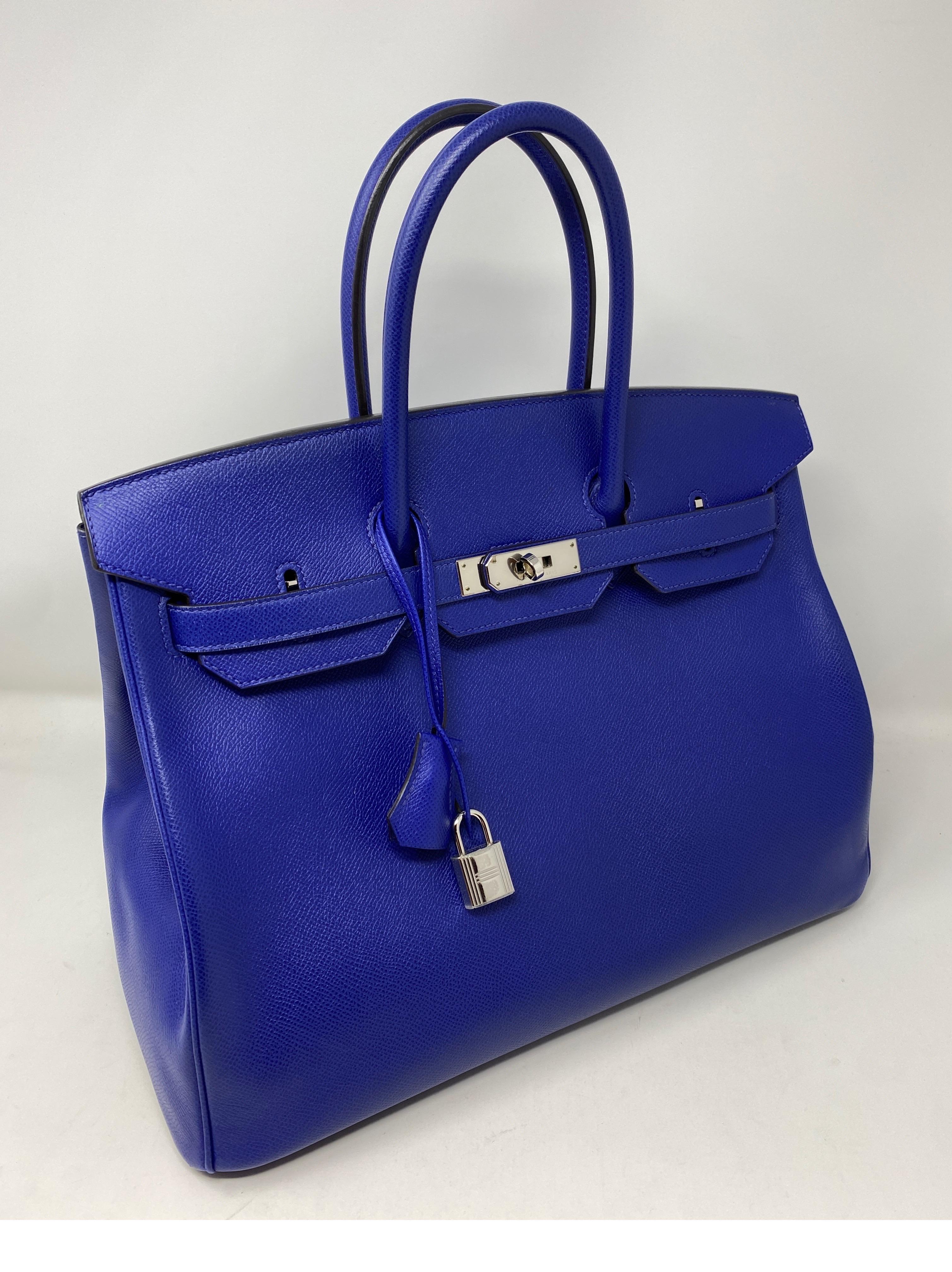 Hermes Bleu Electrique Birkin 35 Bag. Rare blue color. Palladium hardware. Epsom leather. R stamp. From 2014. Looks brand new. Mint condition. Still has plastic on hardware. Don't miss out on this one. Includes clochette, lock, keys, and dust cover.