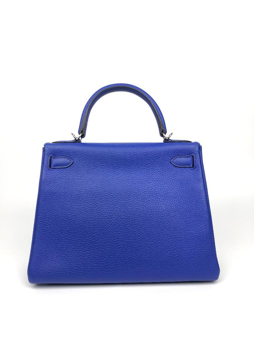 This authentic Hermès Bleu Electrique Togo Leather 28 cm Kelly Bag is in excellent plus condition.  Hermès bags are considered the ultimate luxury item worldwide.  Each piece is handcrafted with waitlists that can exceed a year or more.  The