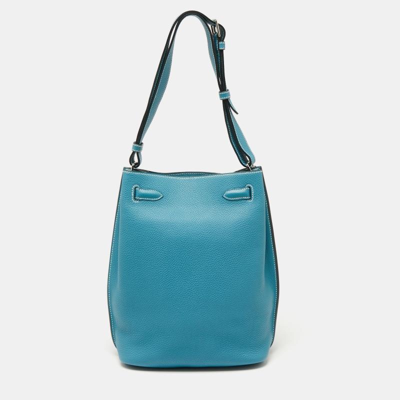 The elegant and timeless elements of the iconic Kelly are coupled with a more casual silhouette in this coveted So Kelly bag. It is crafted from Togo leather in a bucket-like shape with the signature Kelly lock in silver-tone metal on the front and