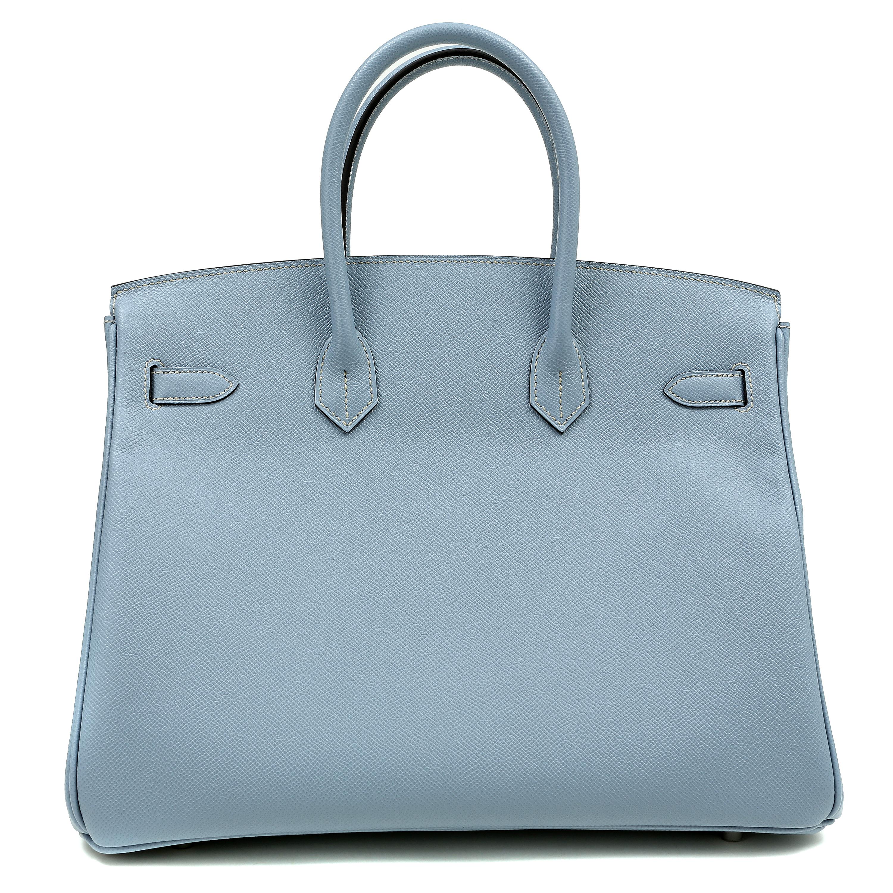 This authentic Hermès Bleu Lin Epsom 35 cm Birkin is in pristine unworn condition; the protective plastic is still intact on the hardware.    Considered the ultimate luxury item, the Hermès Birkin is stitched by hand. Waitlists are commonplace.  