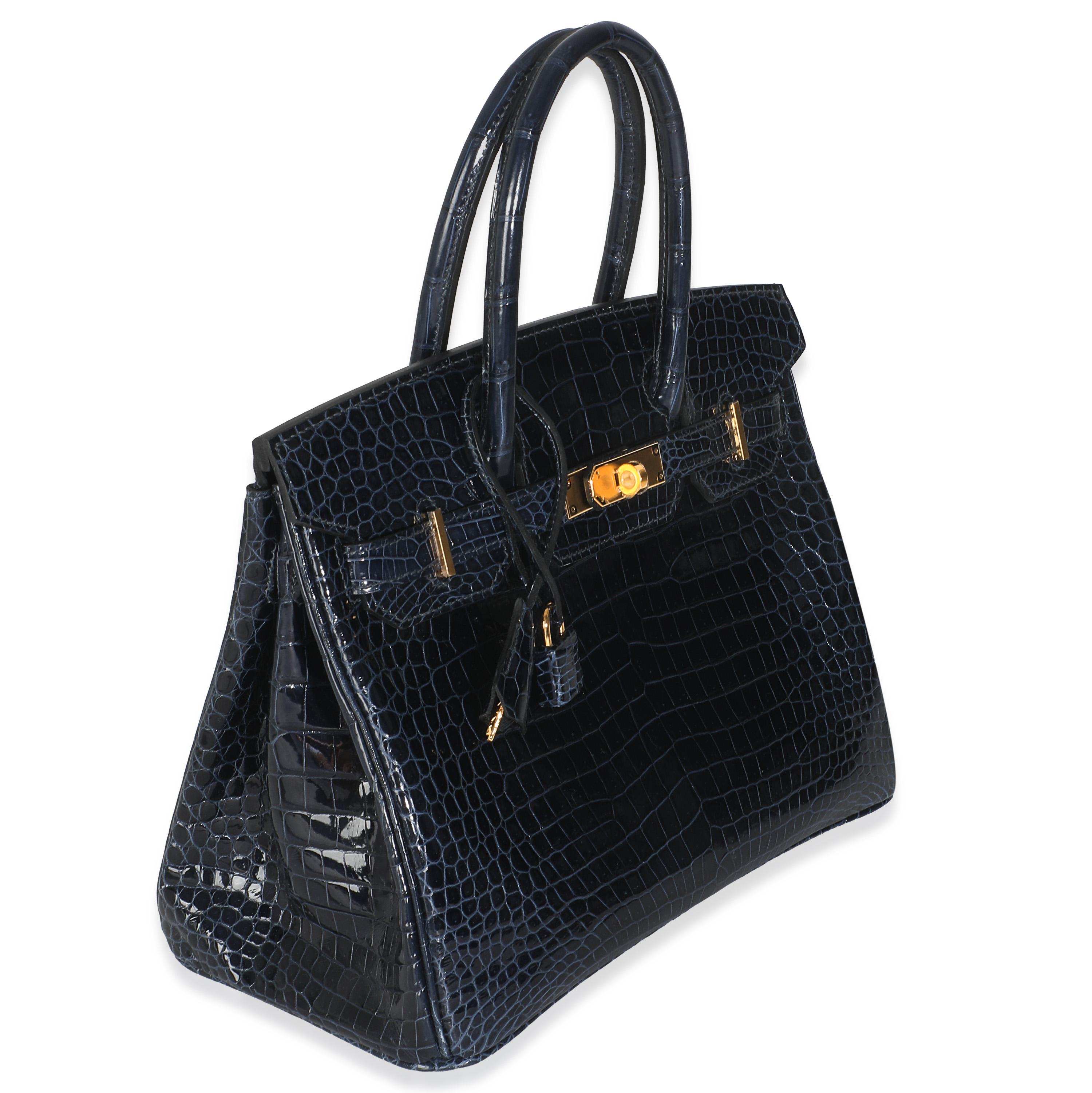Listing Title: Hermès Bleu Marine Crocodile Porosus Birkin 30 GHW
SKU: Z146489
Condition: Pre-owned 
Condition Description: The elusive Birkin bag from Hermès was designed after then-artistic director, Jean-Louis Dumas, was sat next to Jane Birkin