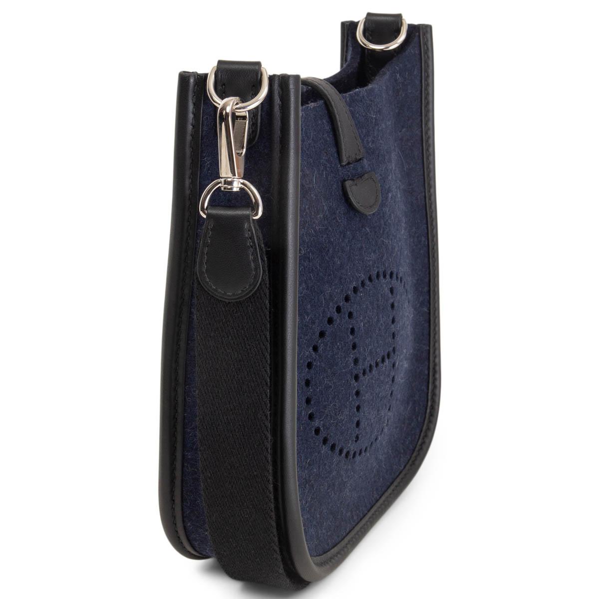 100% authentic Hermès Evelyne 16 Amazon crossbody bag in Bleu Nuit (midnight blue) Feutre (wool felt) and Noir (black) Veau Swift leather with a black wooly canvas shoulder strap, perforated leather 