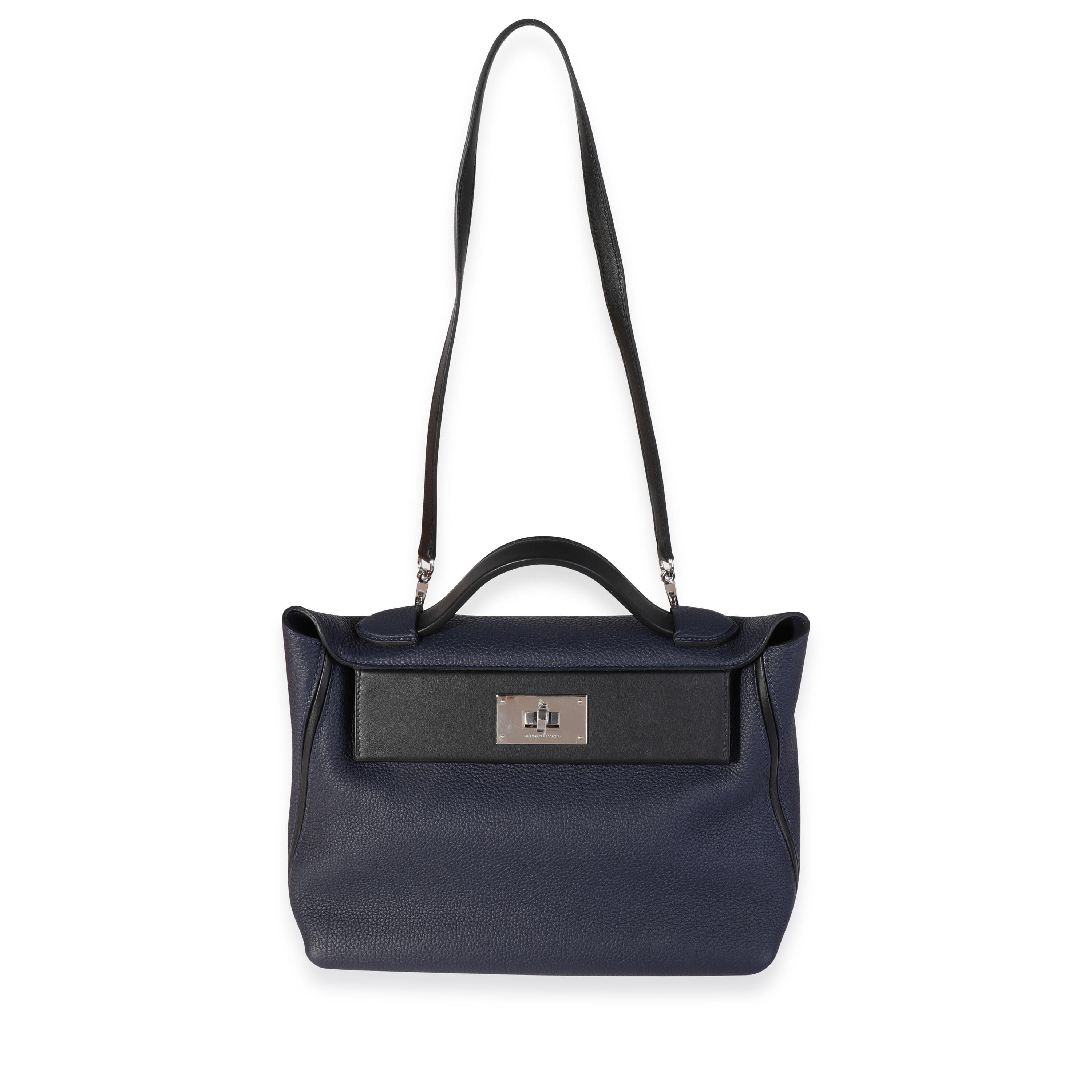 Listing Title: Hermès Bleu Nuit Togo & Black Swift 24/24 21 Bag PHW
SKU: 120214
Condition: Pre-owned 
Handbag Condition: Very Good
Condition Comments: Very Good Condition. Plastic on hardware. Light scuffing to exterior and interior leather.
Brand: