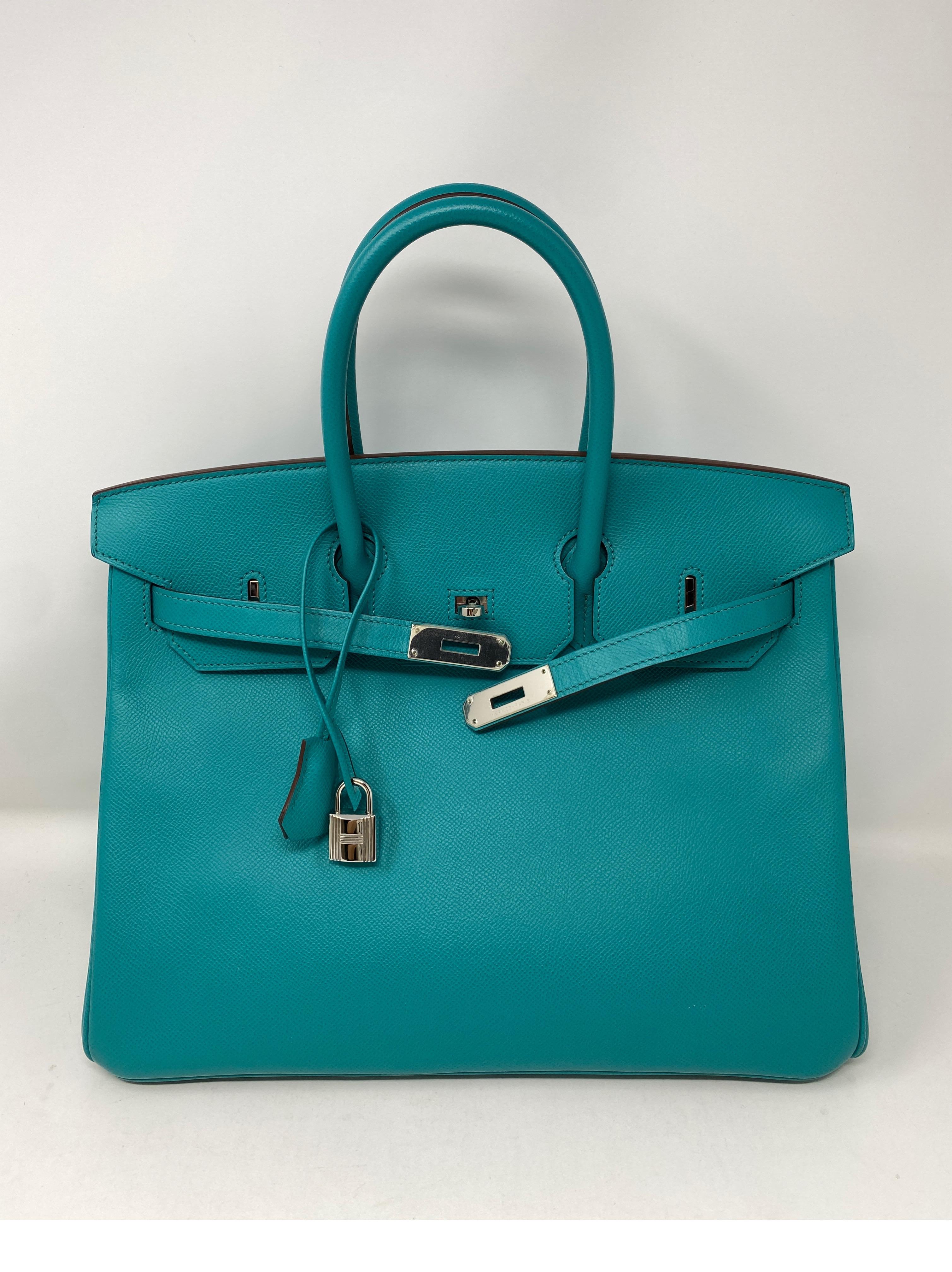 Hermes Bleu Paon Birkin 35 Bag. Palladium hardware. Epsom leather. Gorgeous color. P square. From 2012. Excellent like new condition. Plastic still on hardware. Rare color. Includes clochette, lock, keys and dust cover. Guaranteed authentic. 
