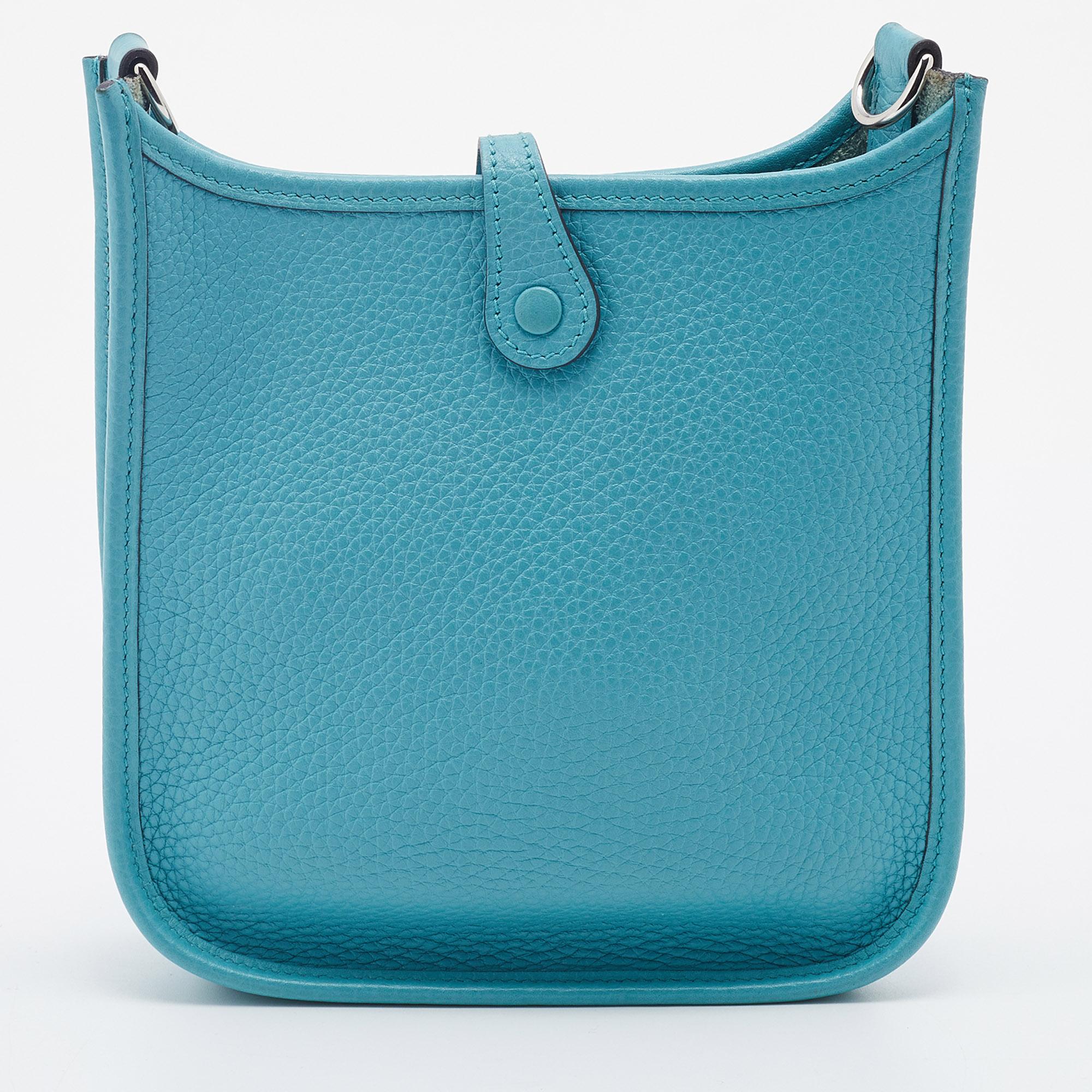 The Evelyne is another investment-worthy bag from Hermès. This one here is crafted from blue Saint Cyr Clemence leather and detailed with the signature elements of the leather tab closure, the saddle-like shape, and the perforated H on the front.