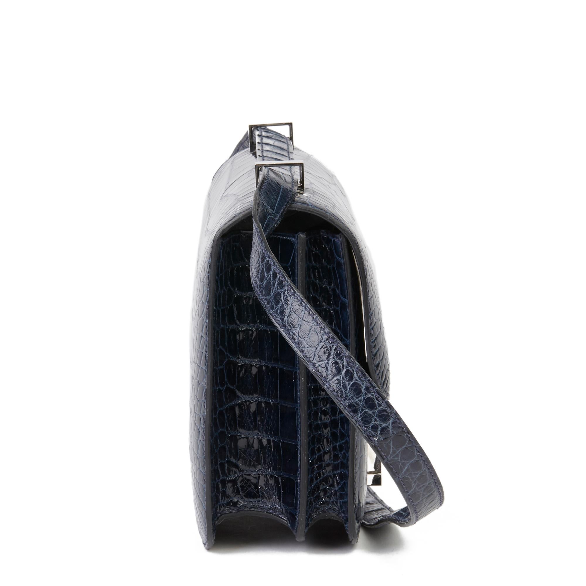 HERMÈS
Bleu Saphir Shiny Mississippiensis Alligator Leather Constance 23

Xupes Reference: CB188
Serial Number: [Q]
Age (Circa): 2013
Accompanied By: Hermès Dust Bag, Box, Care Booklet
Authenticity Details: Date Stamp (Made in France)
Gender: