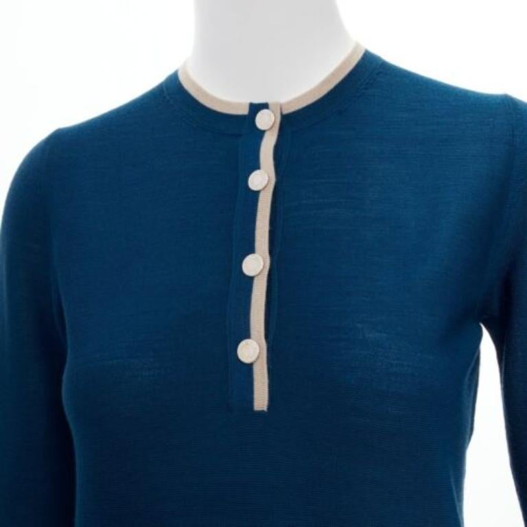 HERMES blue 100% virgin wool H logo buttons knitted polo shirt FR34 XS
Reference: SNKO/A00233
Brand: Hermes
Material: Virgin Wool
Color: Blue, Beige
Pattern: Solid
Closure: Button
Extra Details: HERMES logo buttons.
Made in: